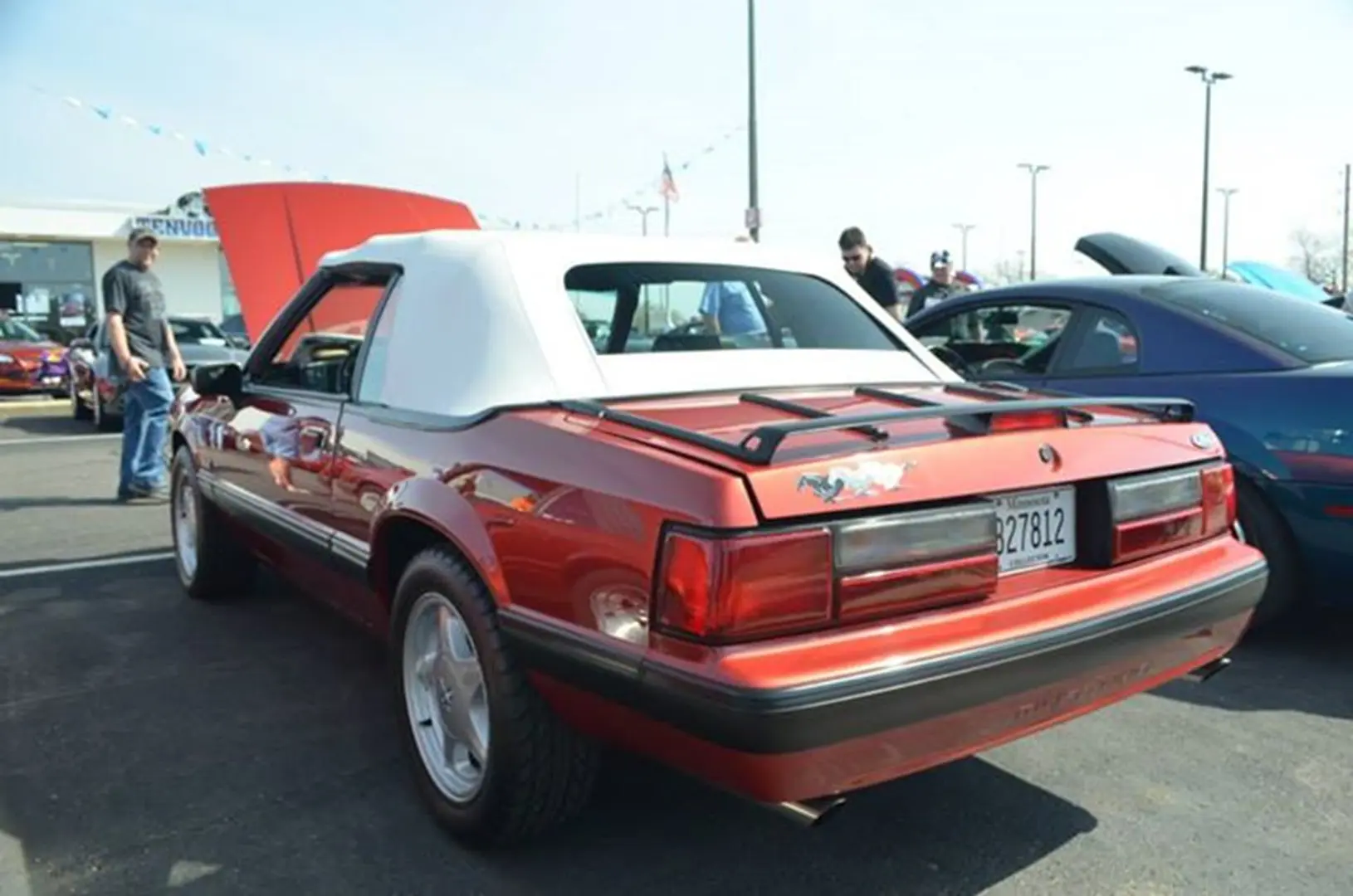 Red classic car at outdoor show