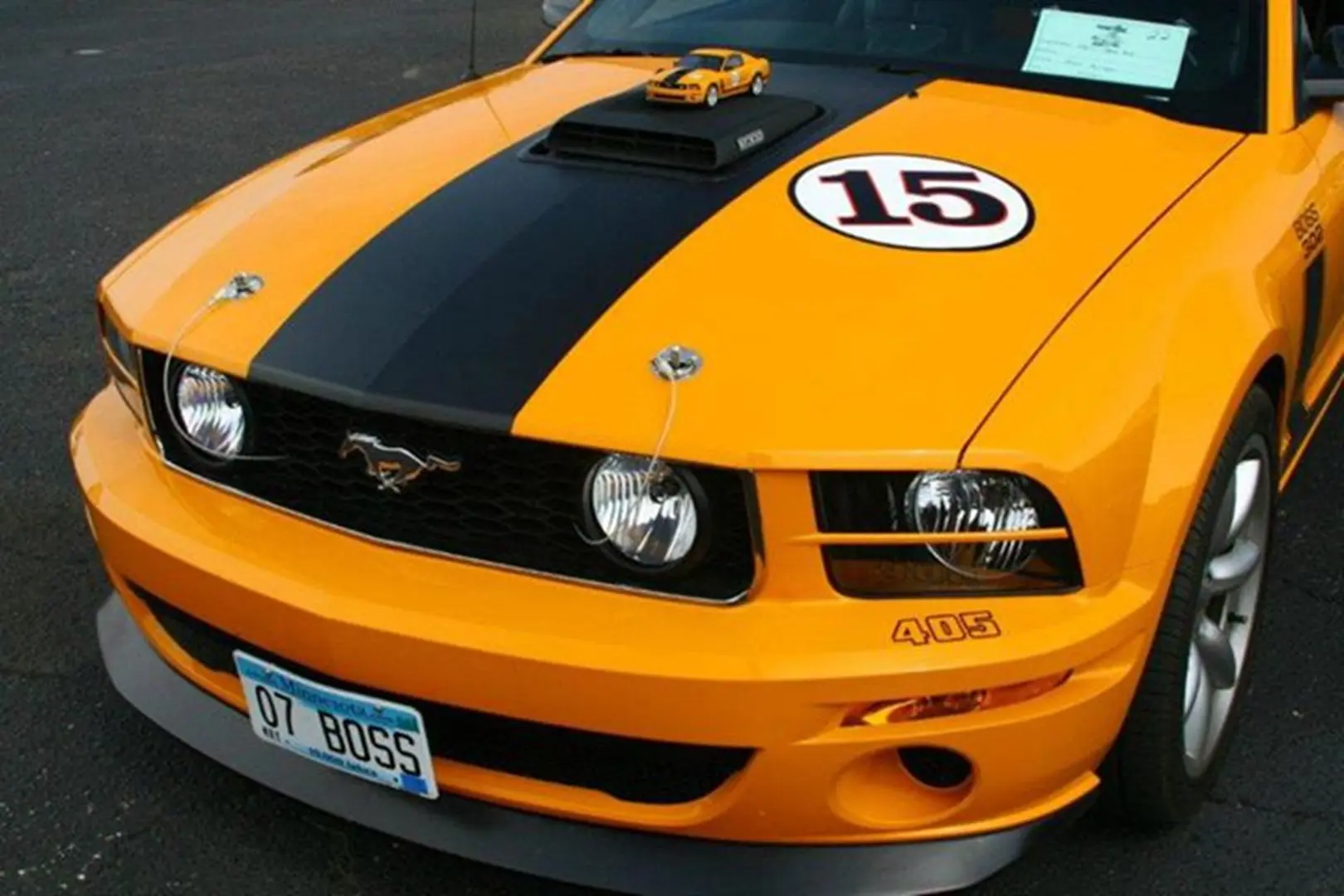 Mustang with model car on hood