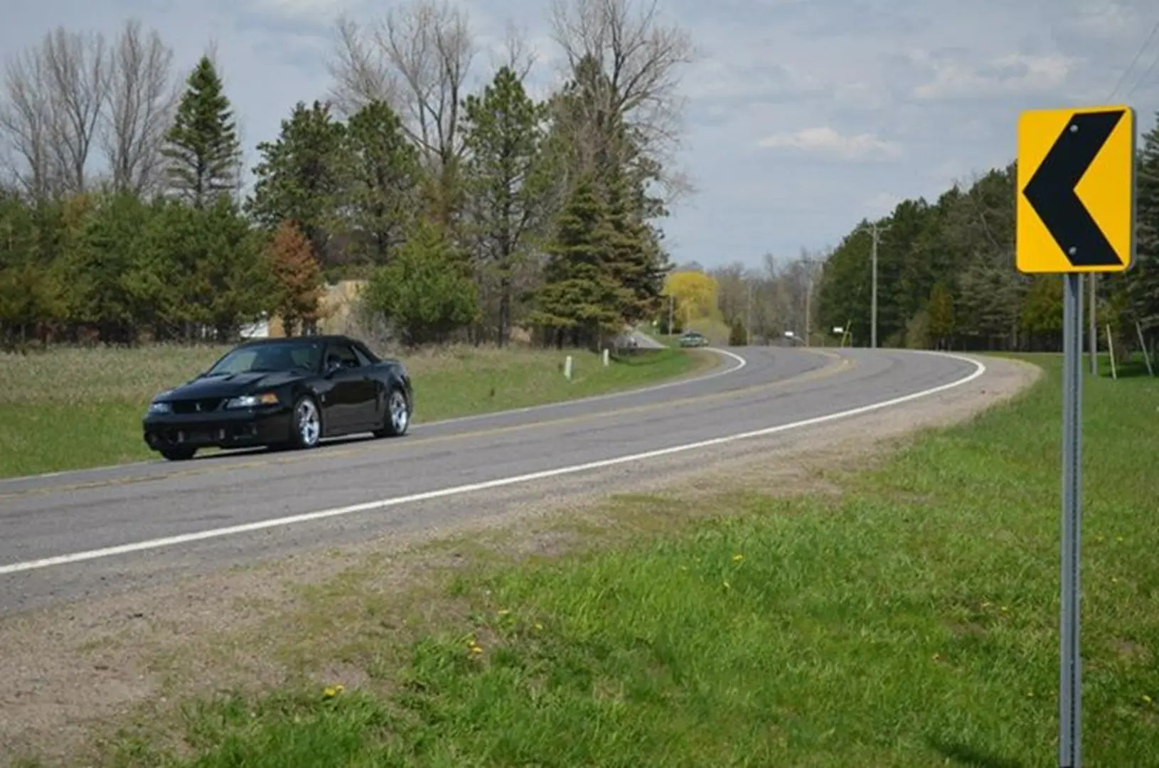 Vehicle approaching curve on country road