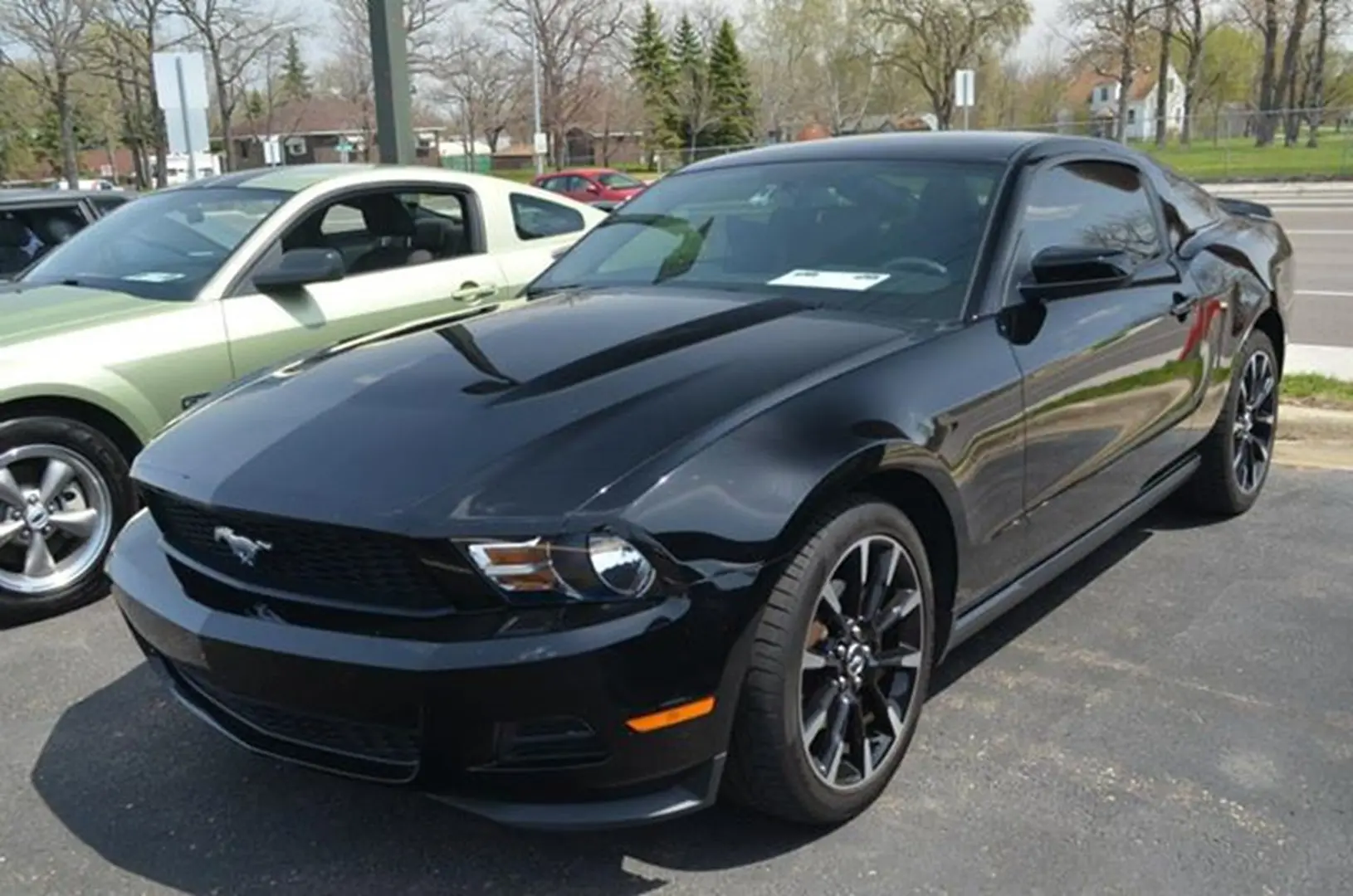 Sleek black car in parking lot