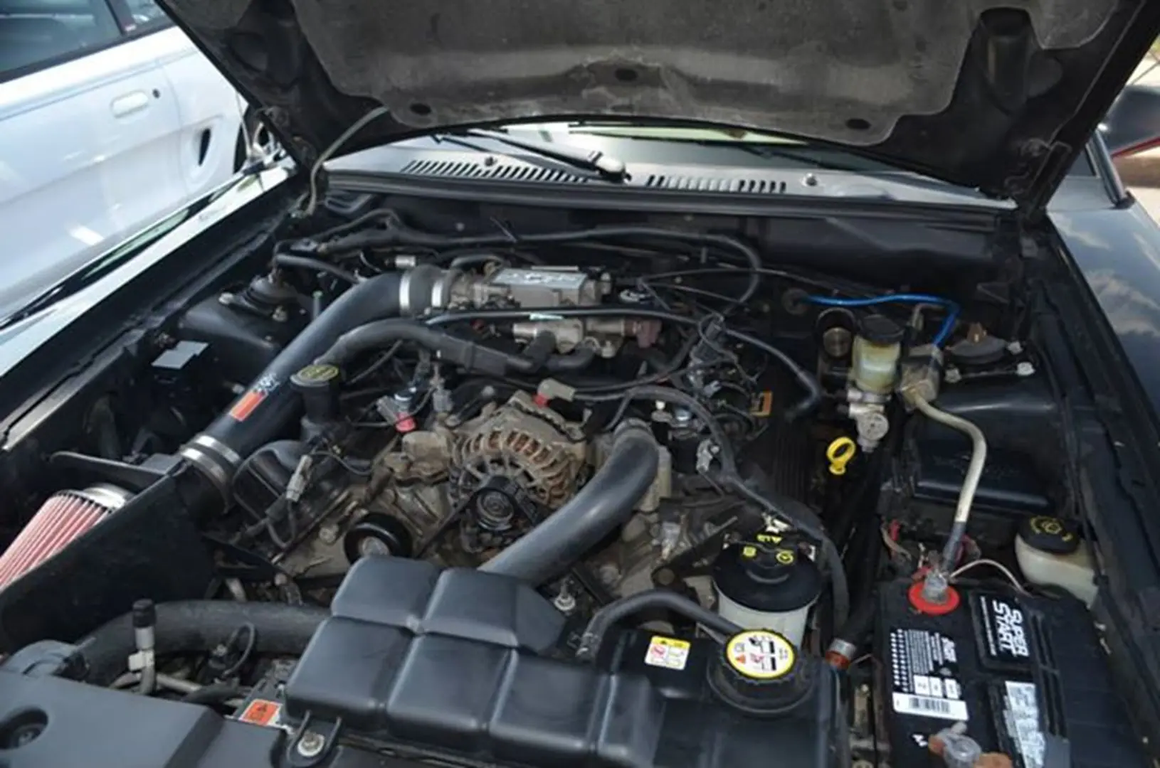 Car engine with open hood