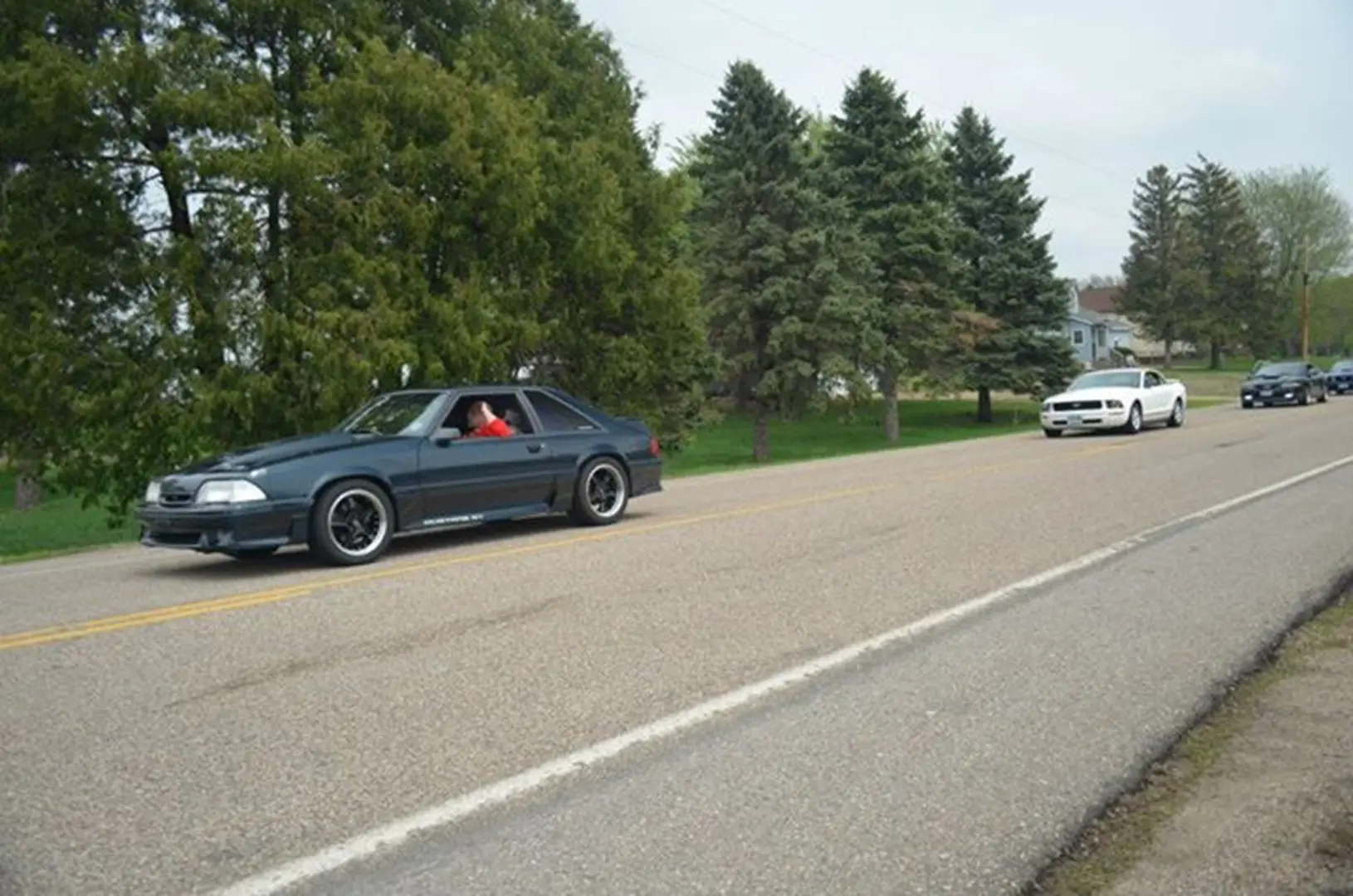 Vehicles on scenic countryside drive