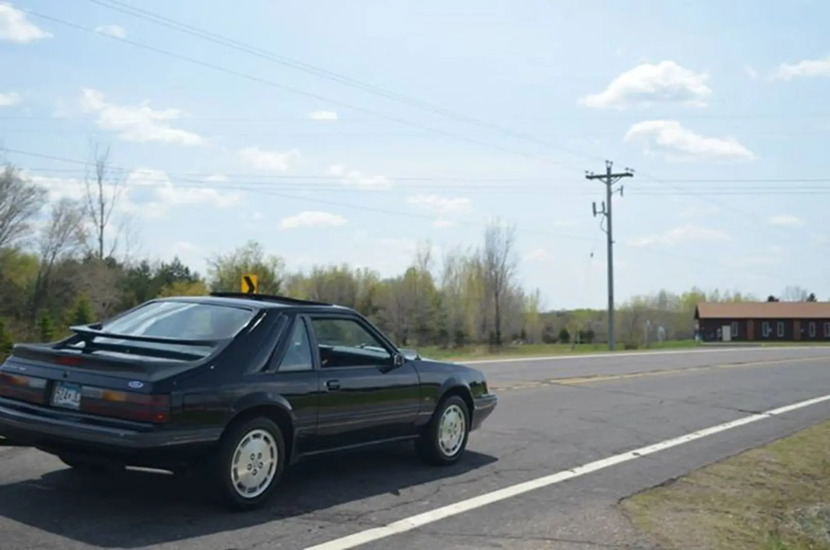 Black car parked on rural road