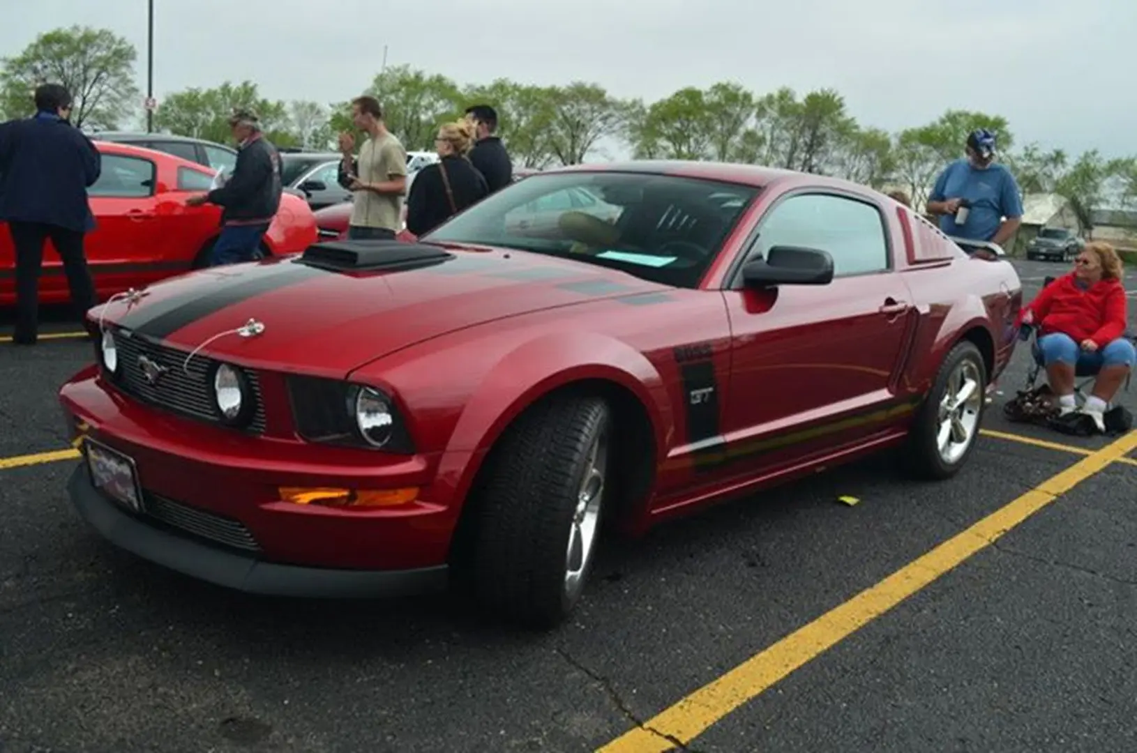 Classic red Mustang at car meet