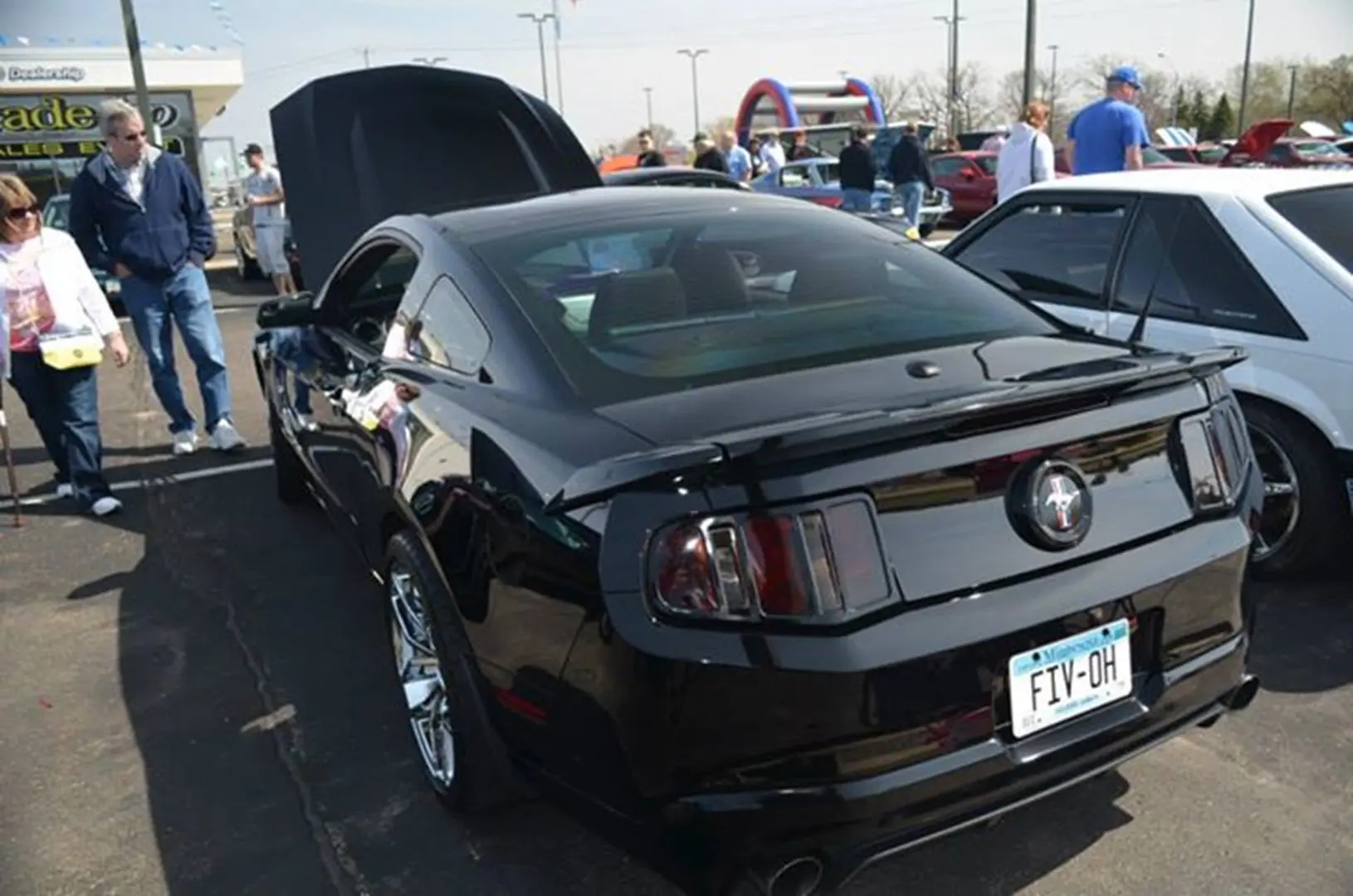 Black sports car at outdoor car show