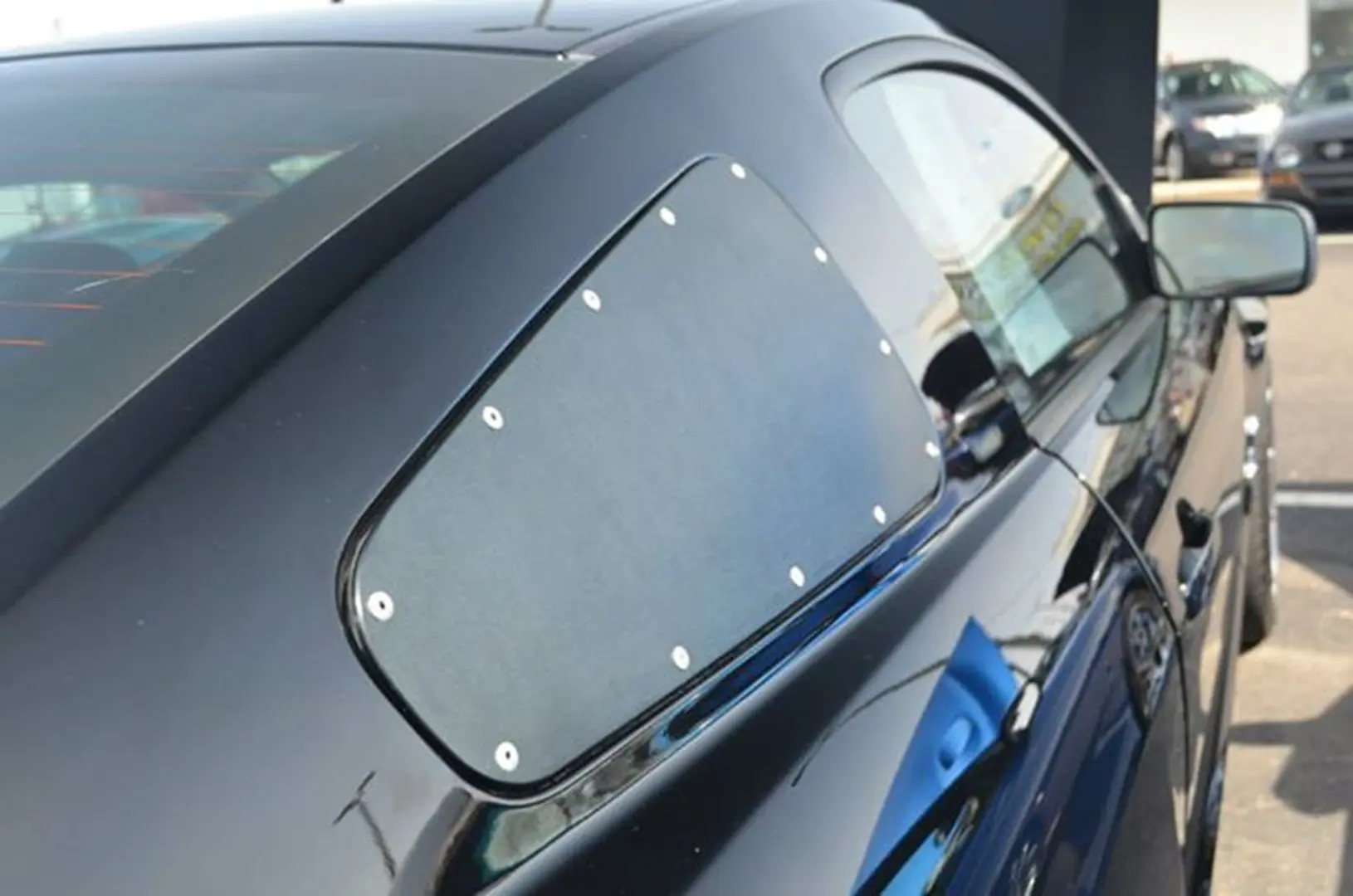 Vehicle window covered with metal plate