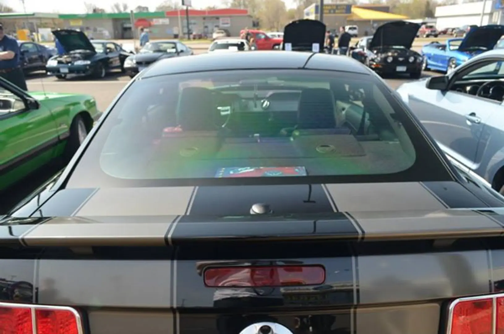 Rear view of parked black sports car