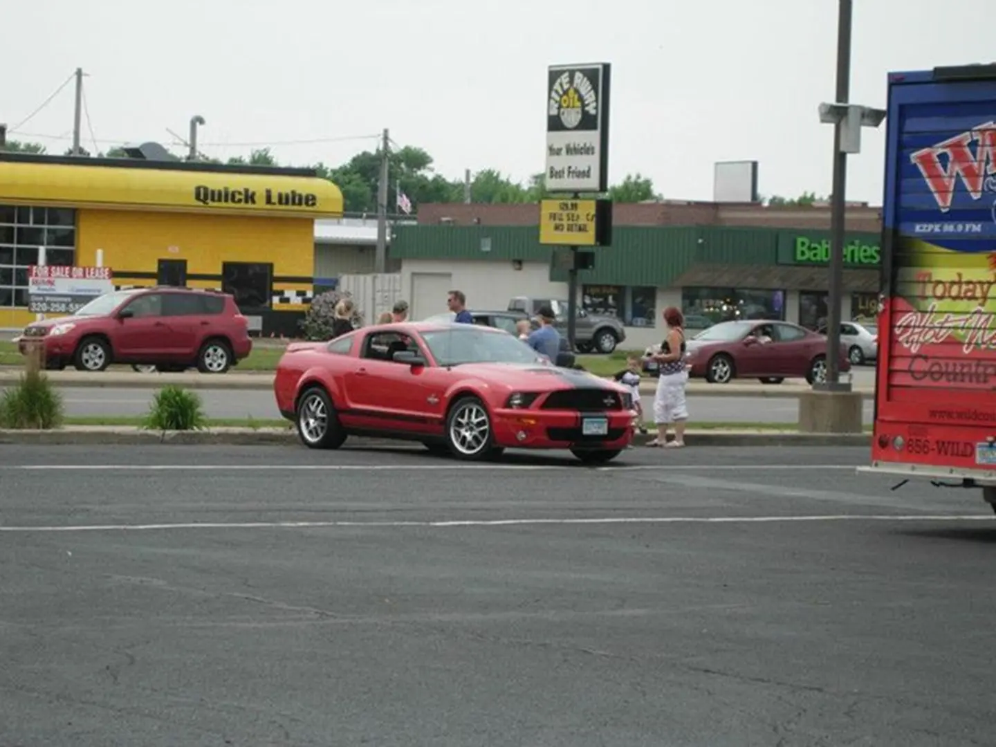 Red car parked near auto shop