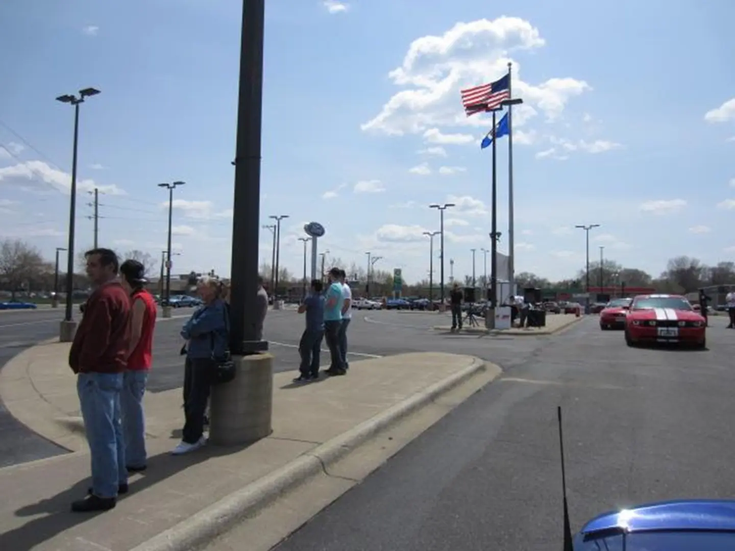 Flag waving above a parking area