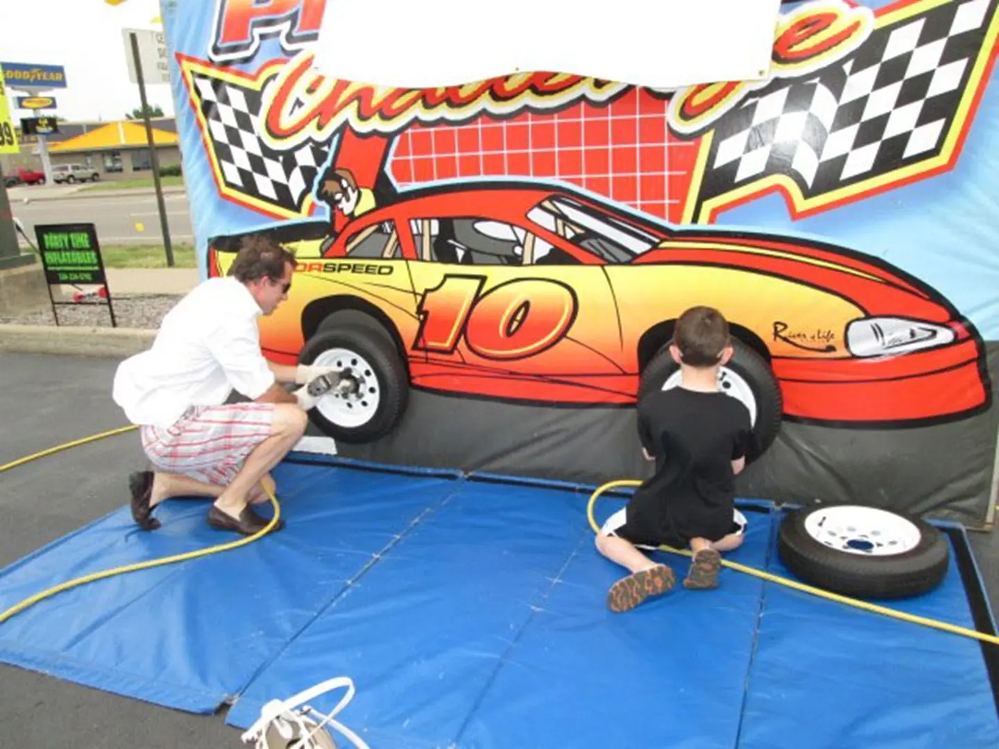 Tire changing game with race car backdrop