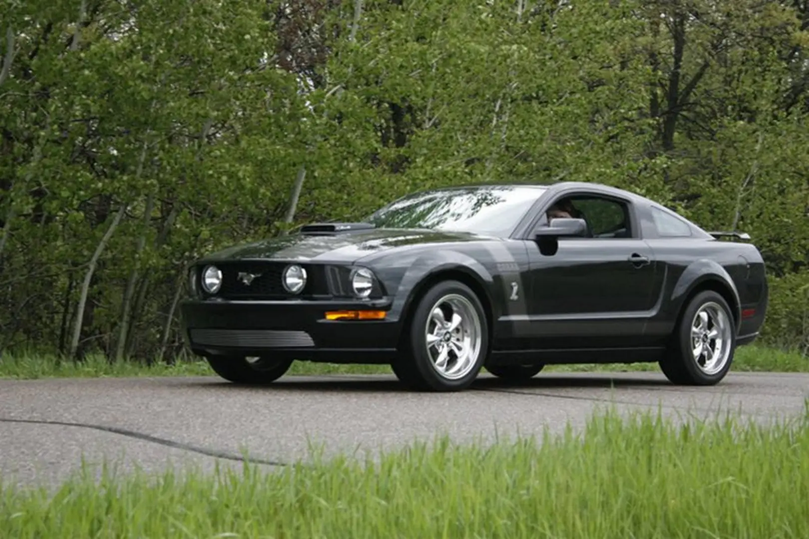 Modern black car with silver wheels