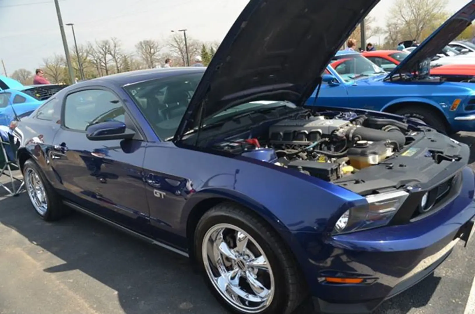 Blue sports car with hood open