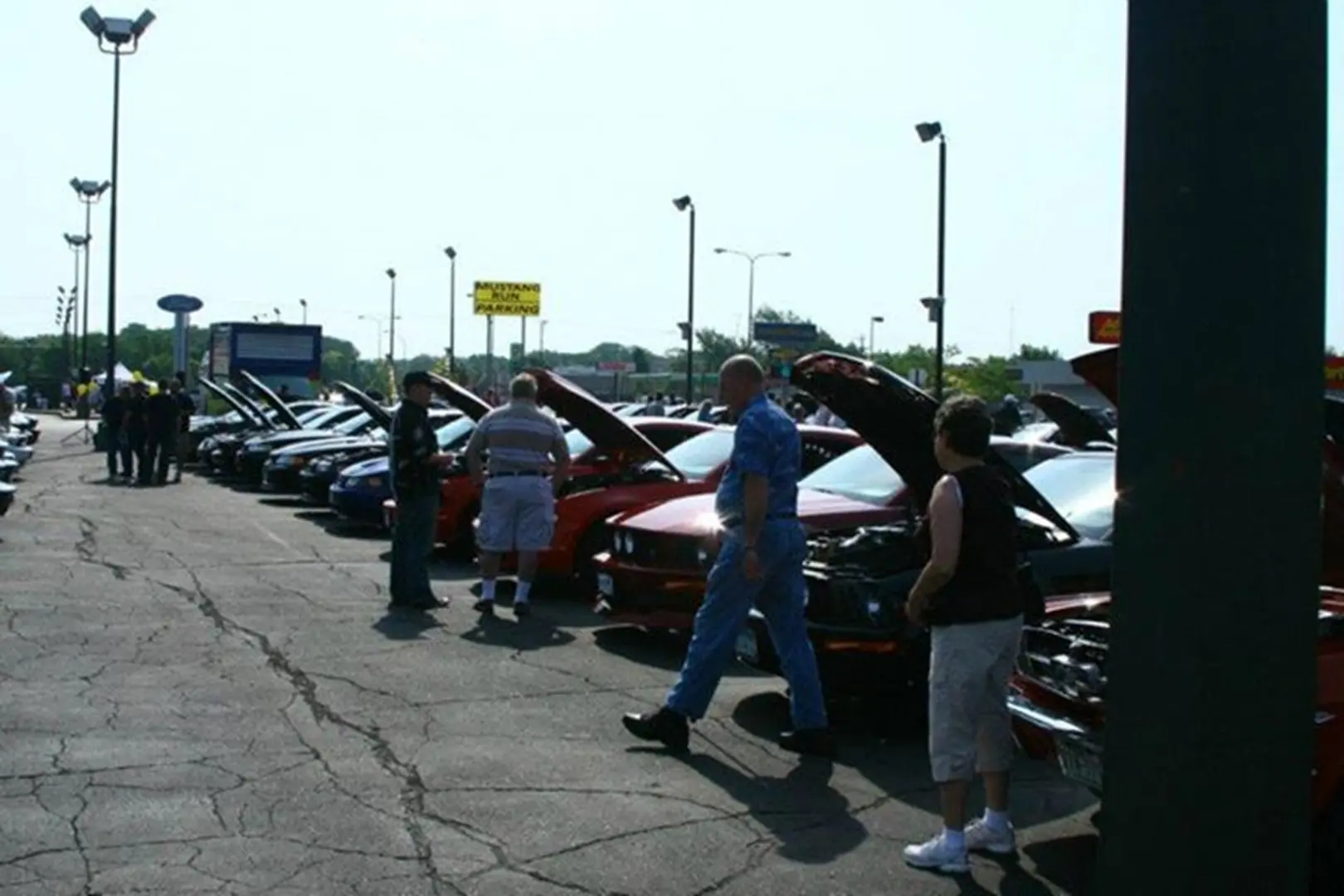 Car enthusiasts at outdoor auto show
