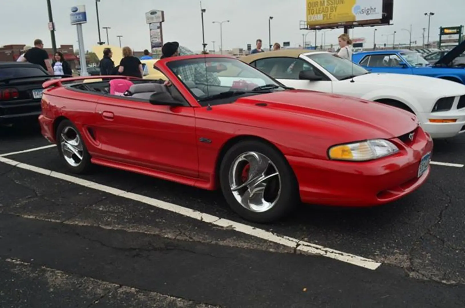 Shiny red convertible at car show