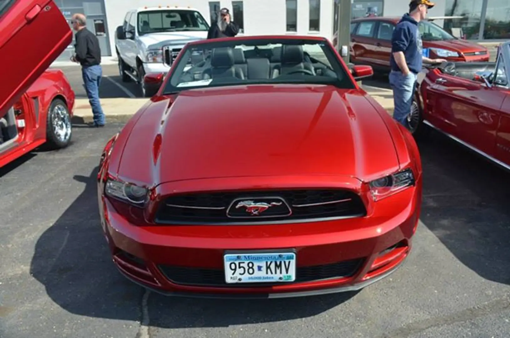 Red car parked at car show