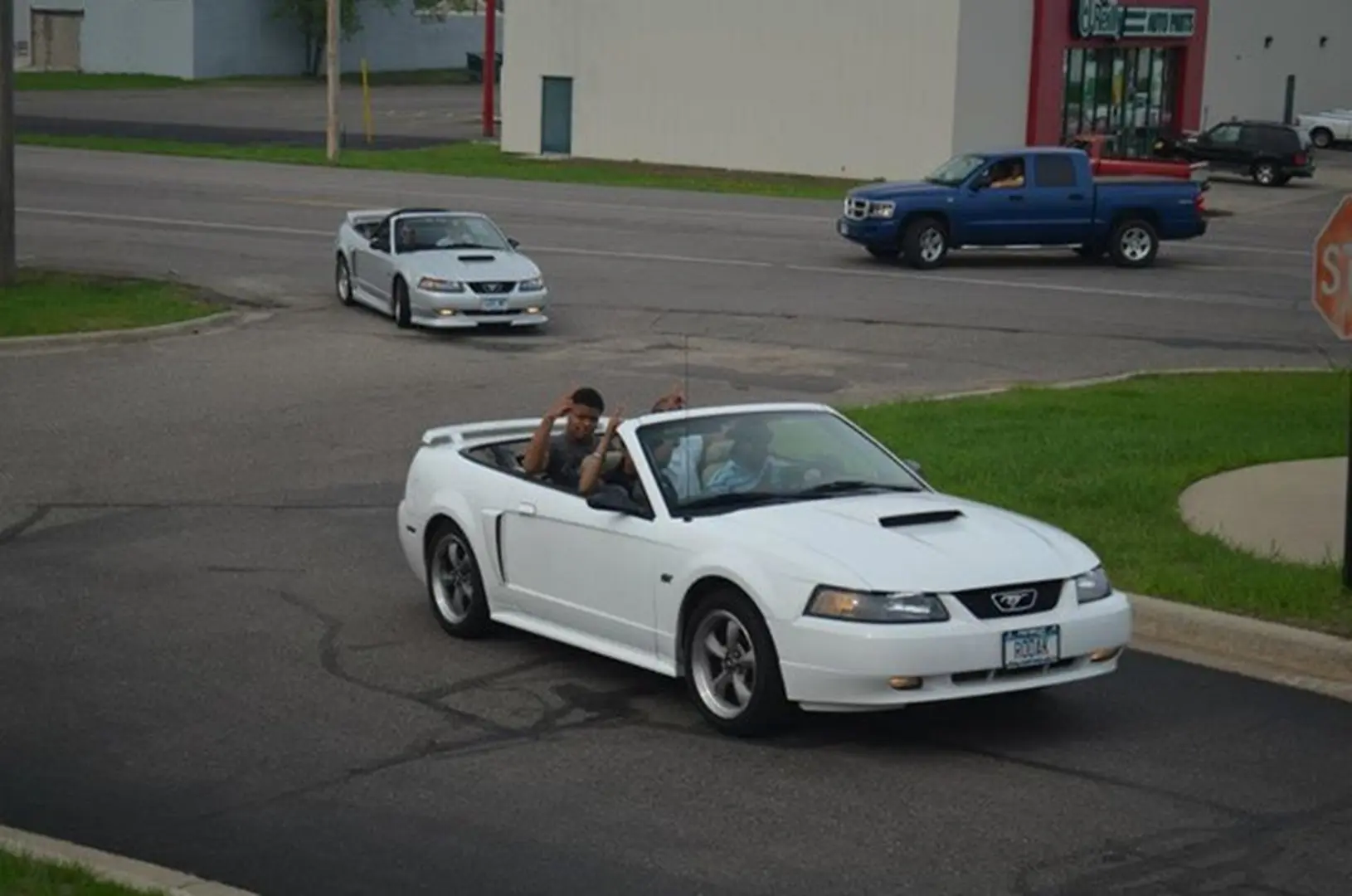 Cars on suburban street intersection