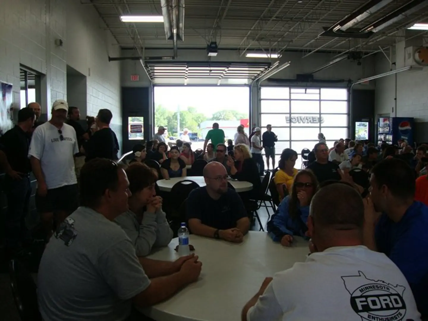 People gathered in a garage meeting