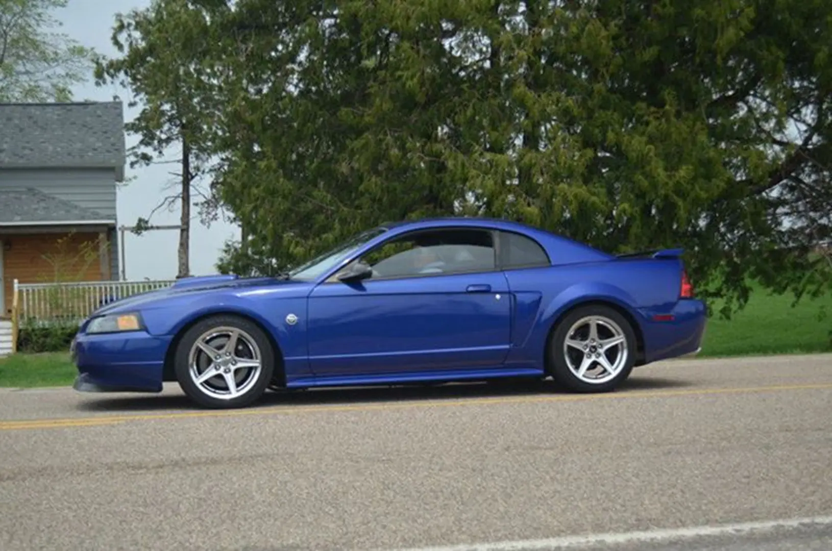 Sleek blue coupe parked outside