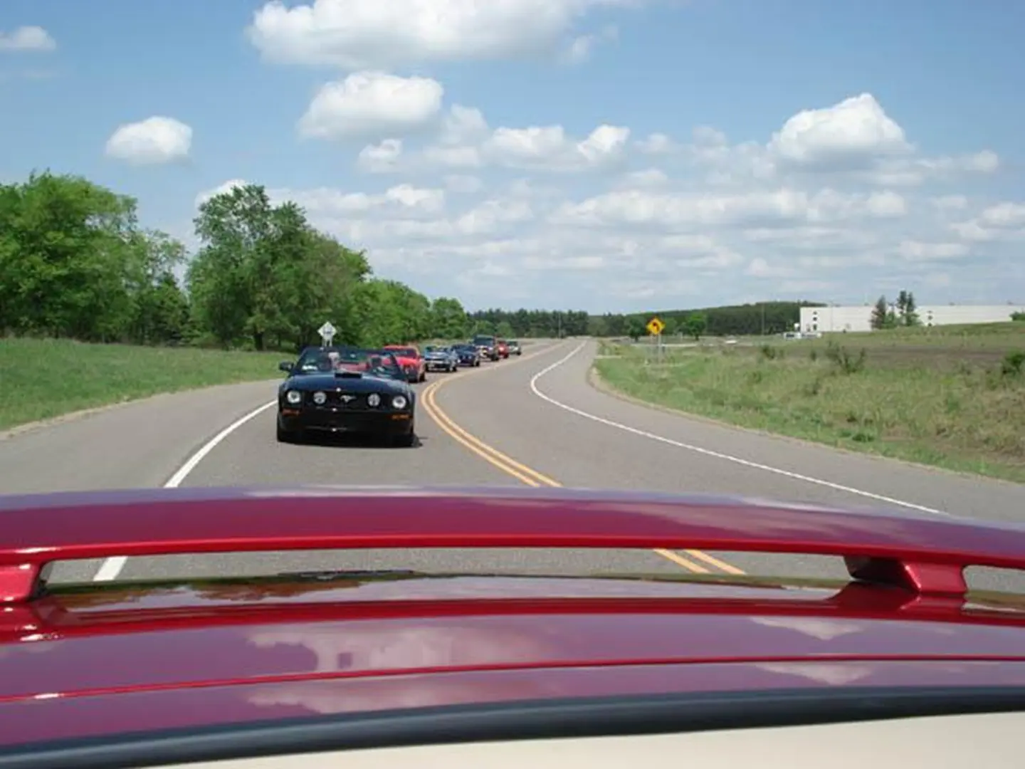 Red car leading a convoy