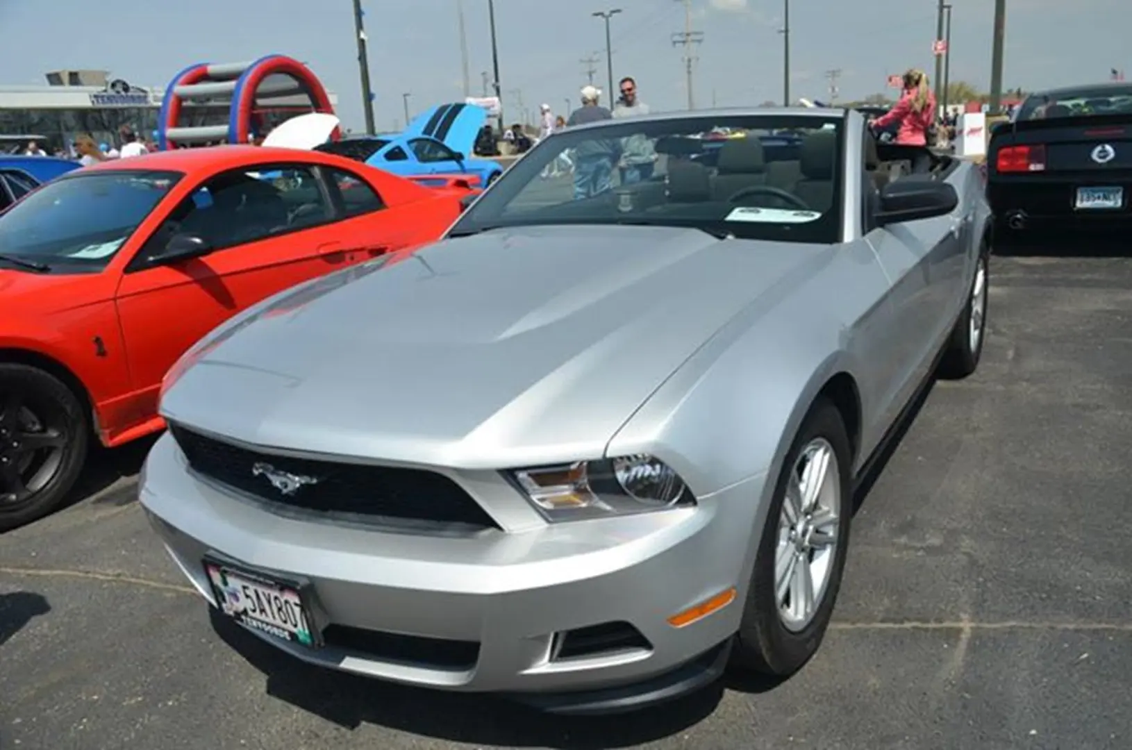 Silver convertible car at a car show