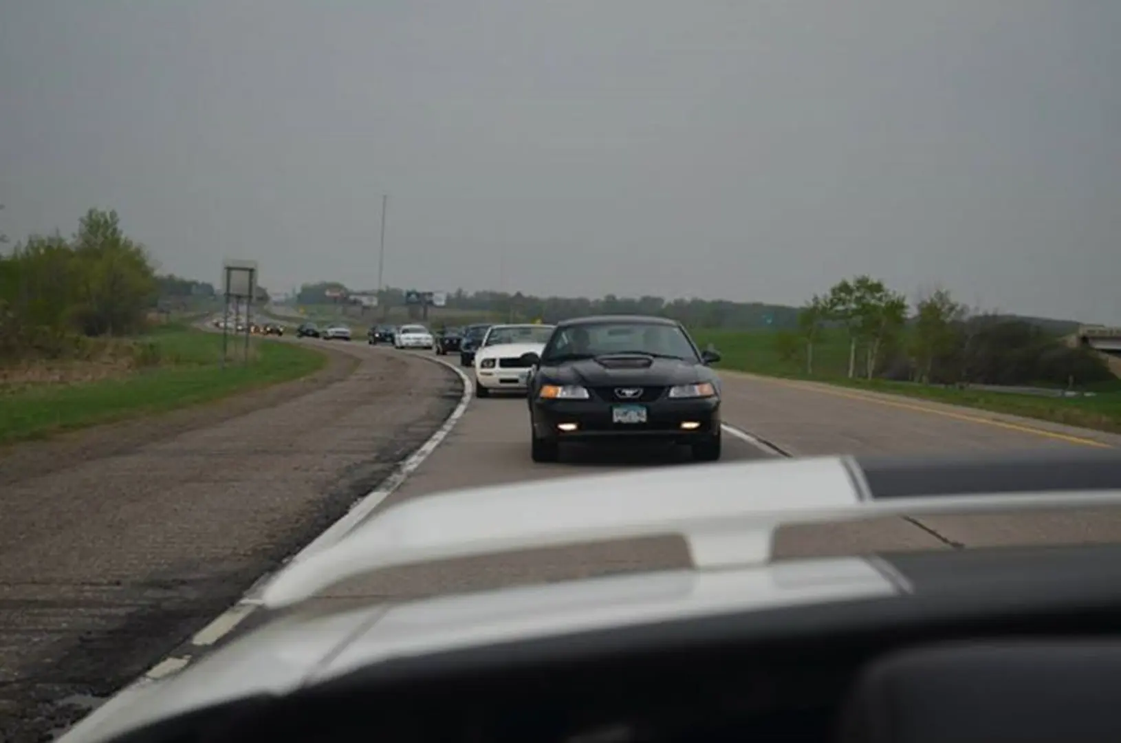 Vehicles lined up on rural highway