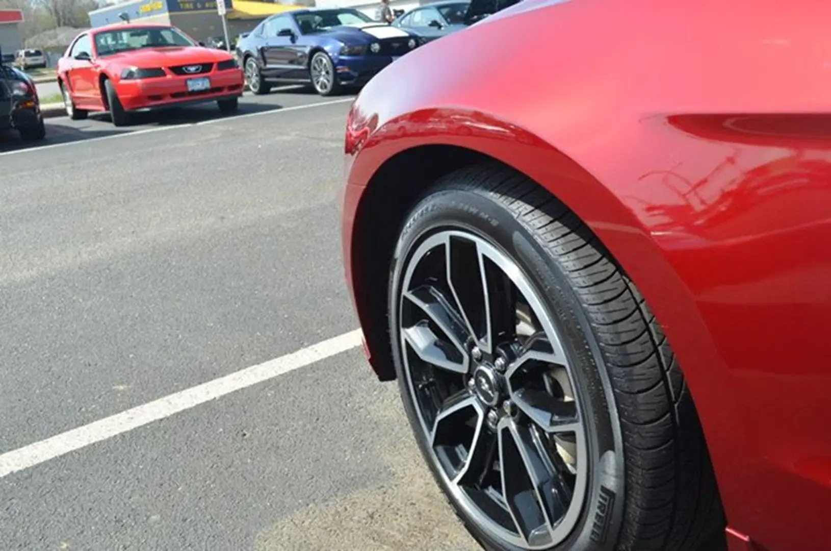 Parking lot with red and black cars