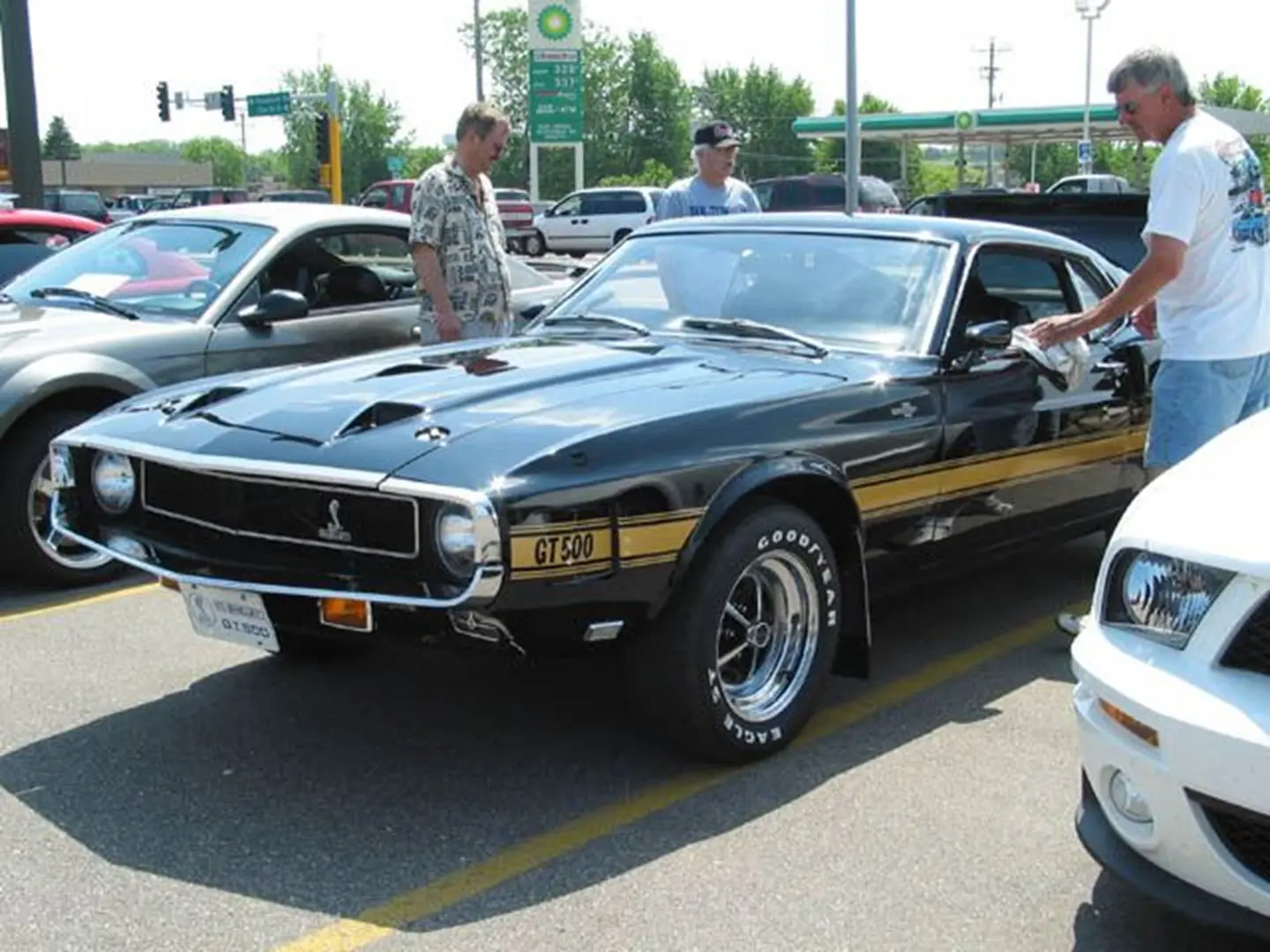 Vintage Mustang with gold stripes on display