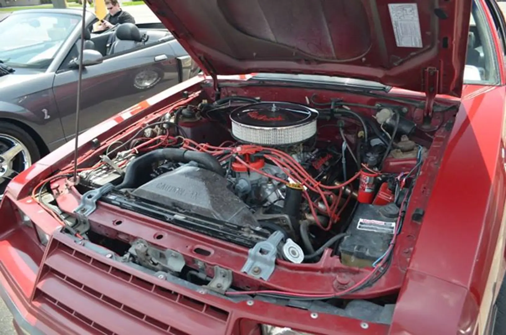 Vintage car engine with red accents