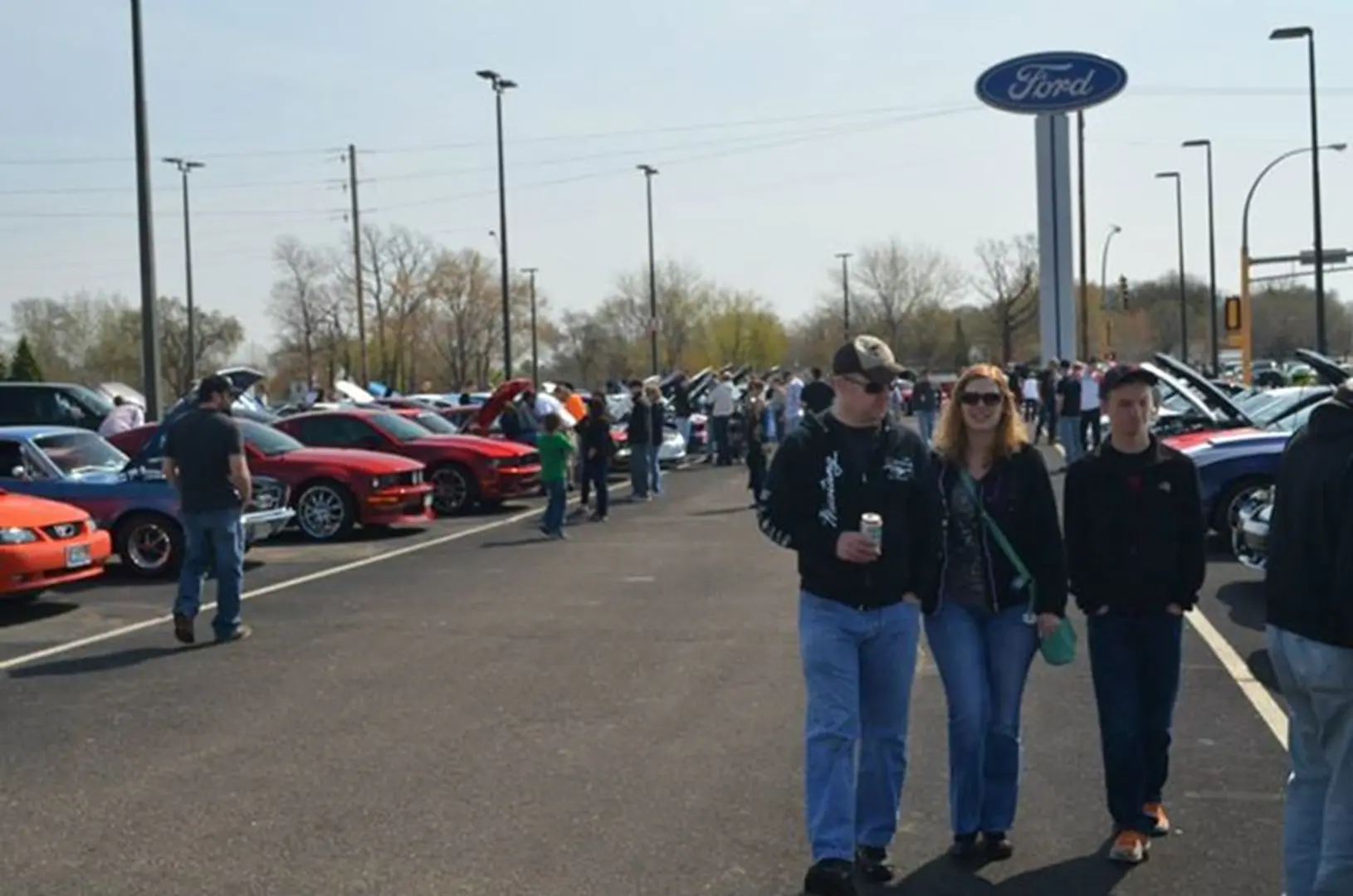 Visitors at outdoor car exhibition