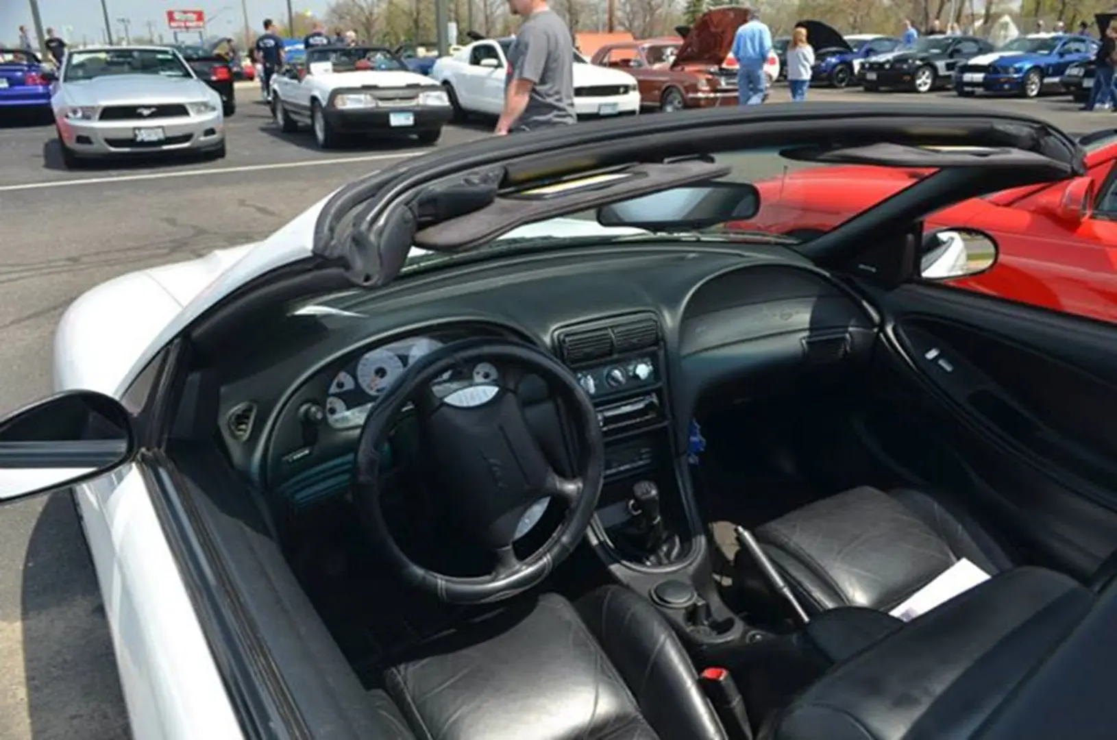 Open-top car with black leather seats
