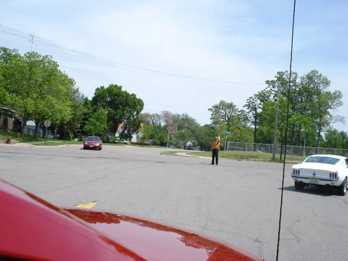 Street intersection with cars and trees
