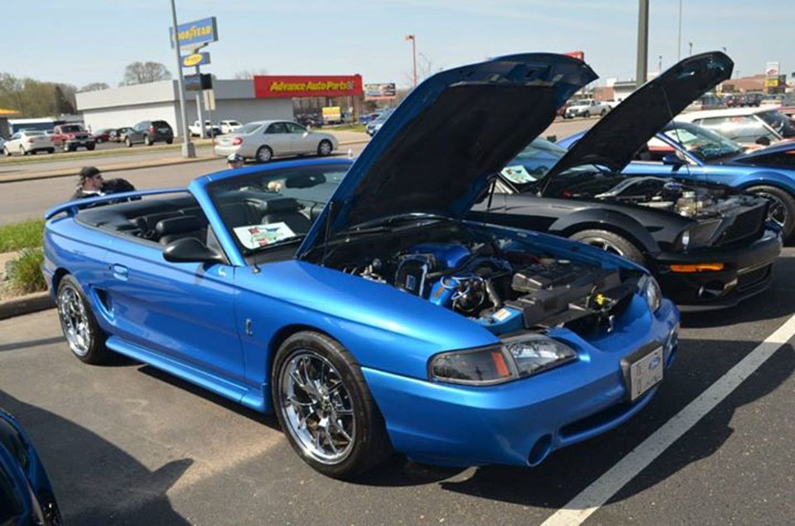 Classic blue car in parking lot