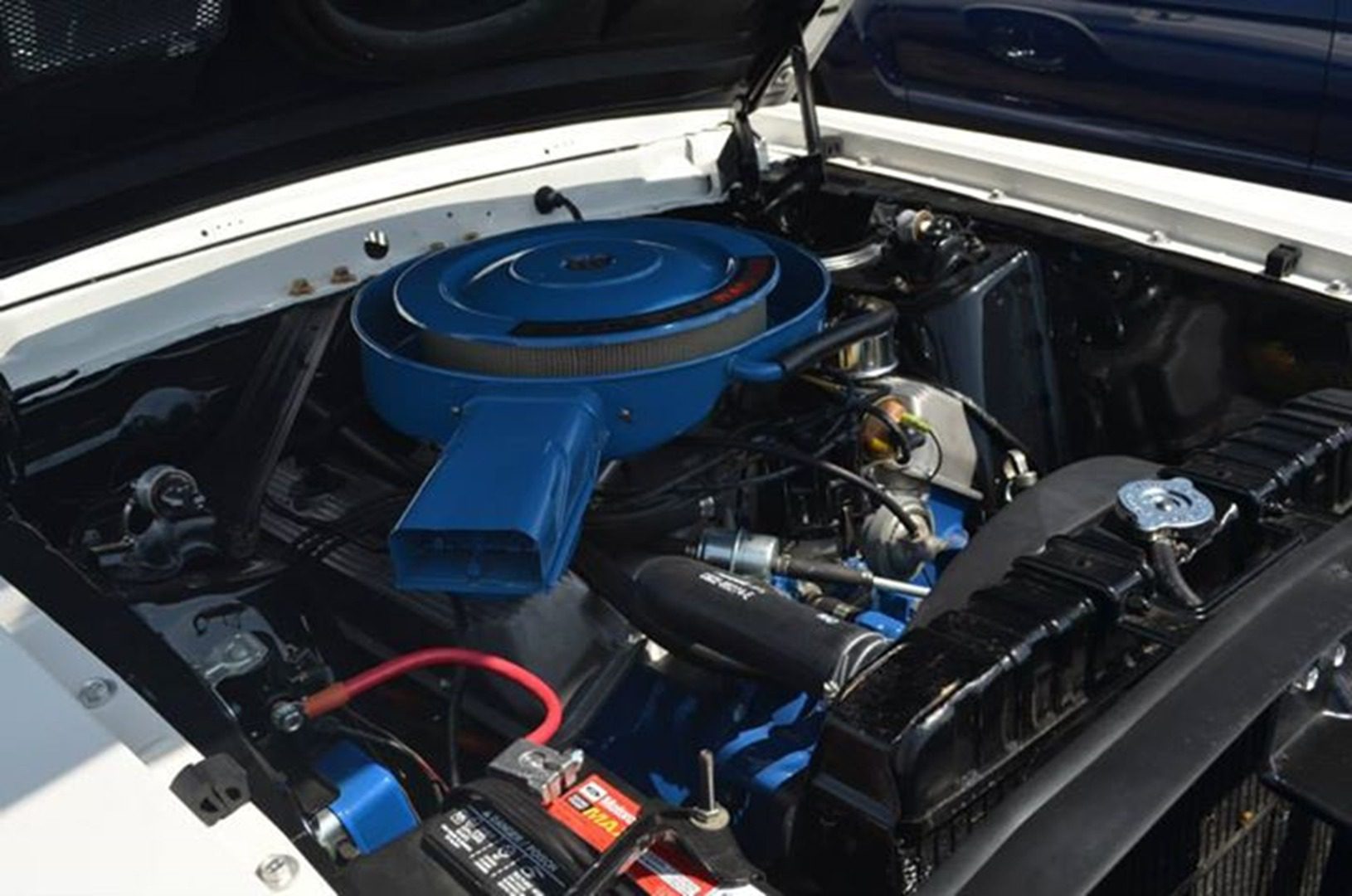 Classic car engine with blue air filter