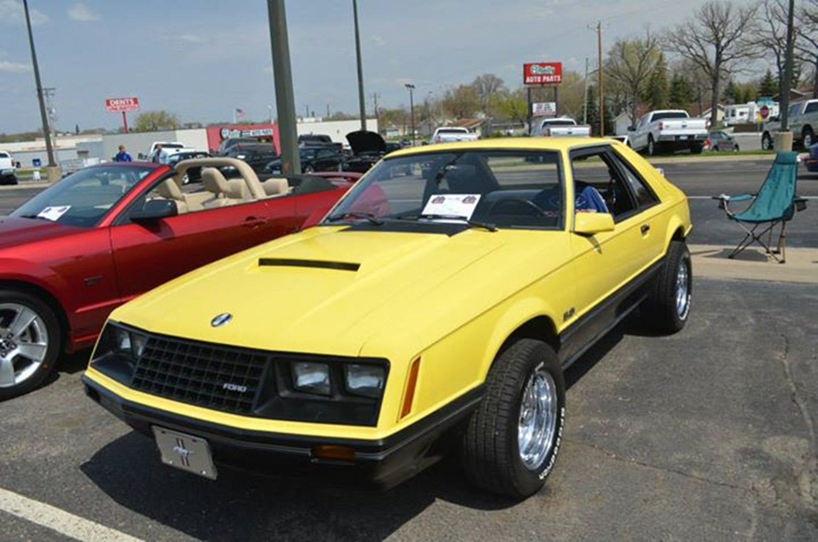 Classic yellow car parked outdoors
