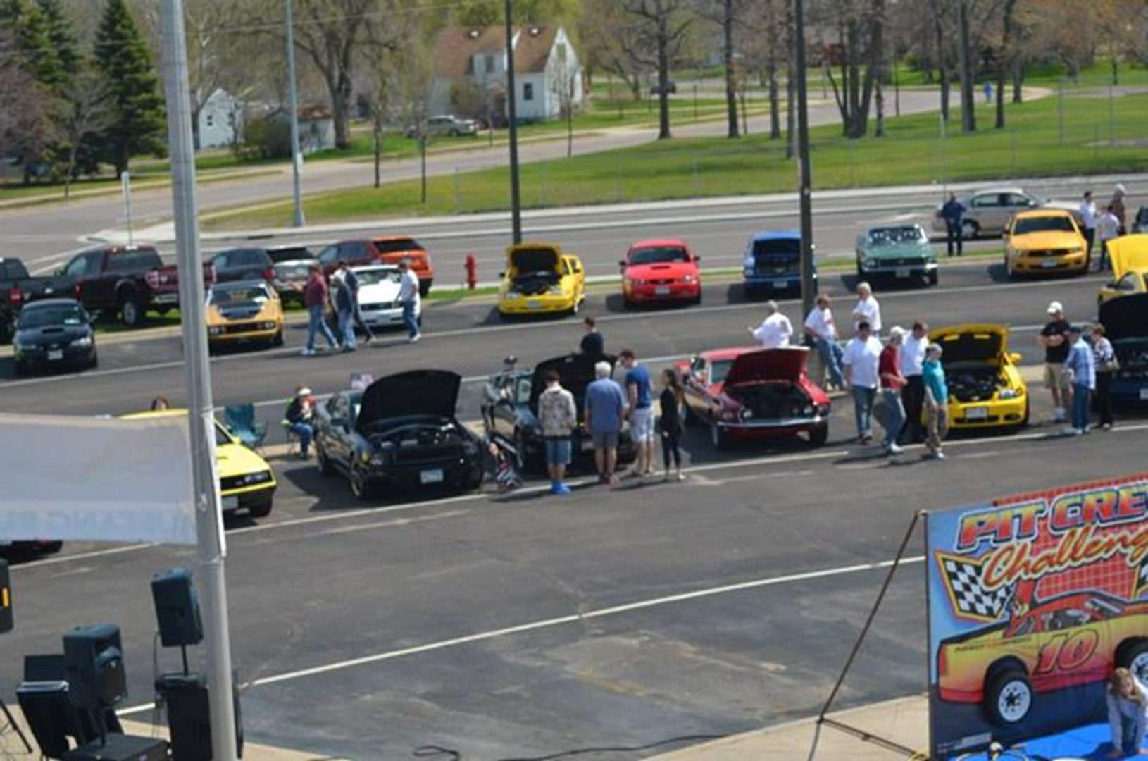 Car show with open hoods