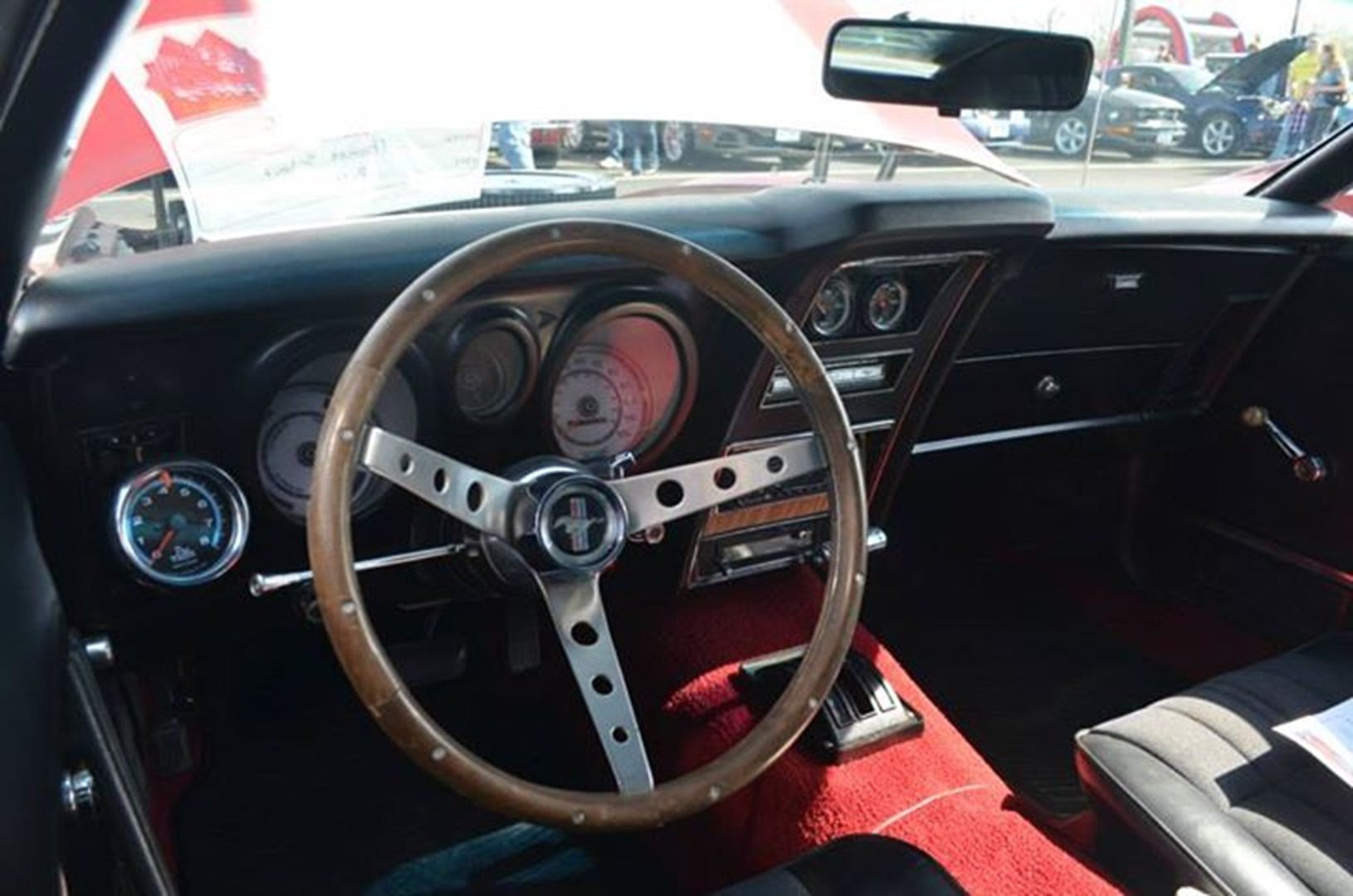 Retro vehicle cockpit featuring red carpet