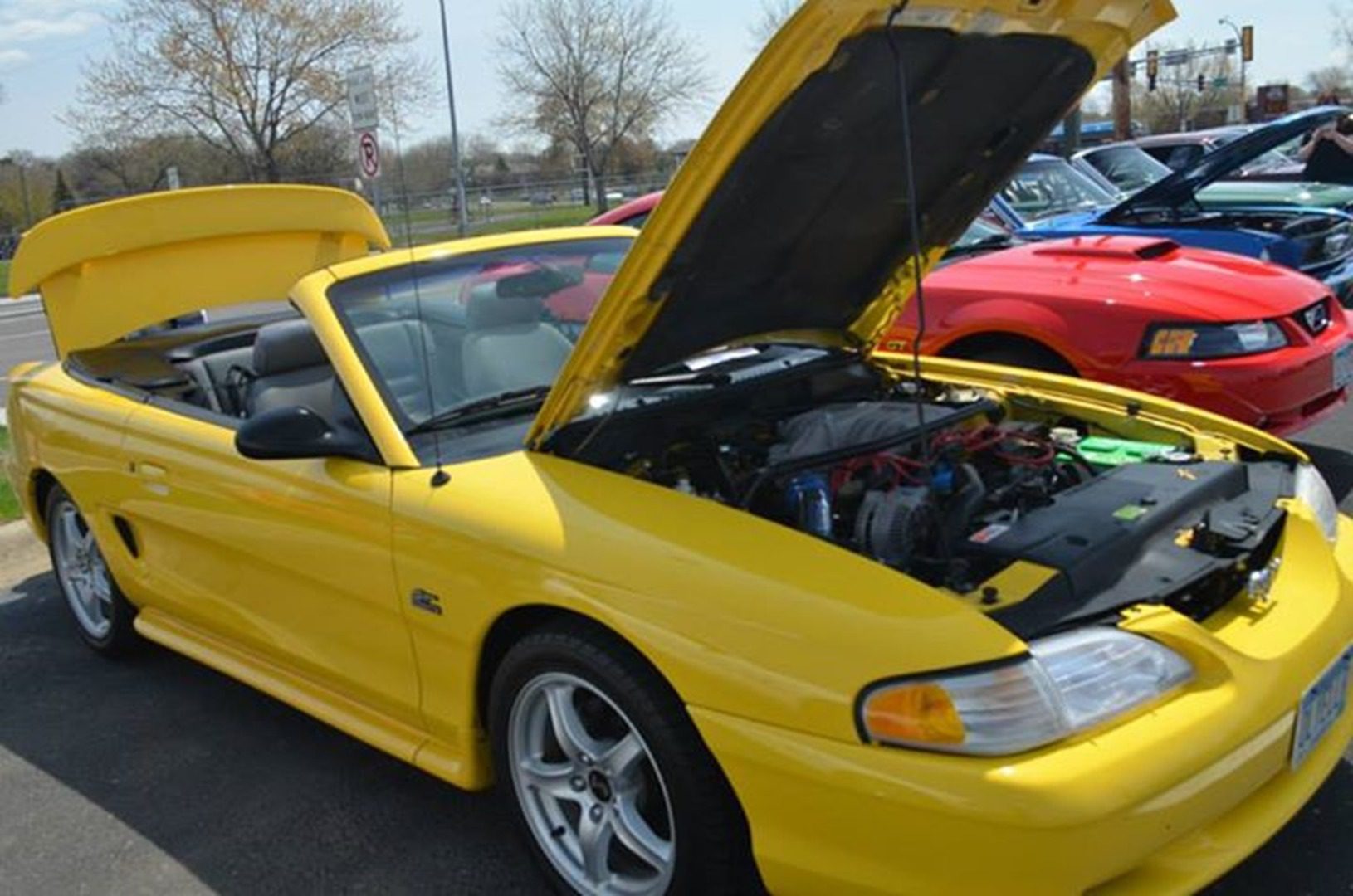 Yellow convertible car with hood open