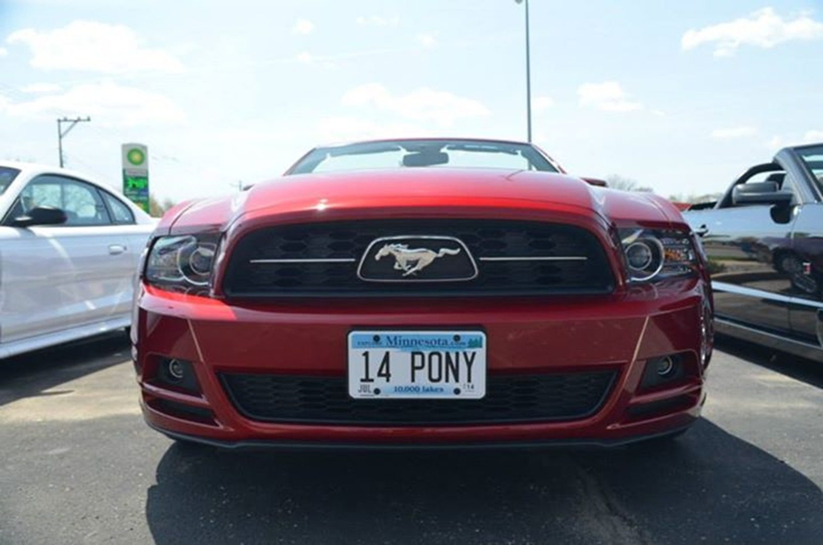 Red sports car with custom license plate