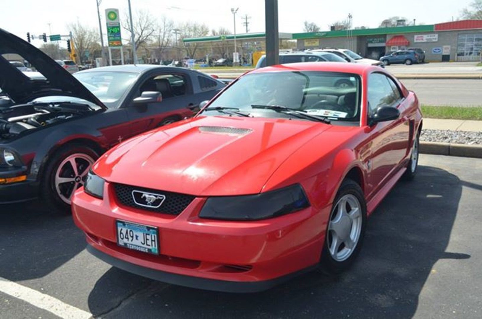 Red car with number plate 649 JEH