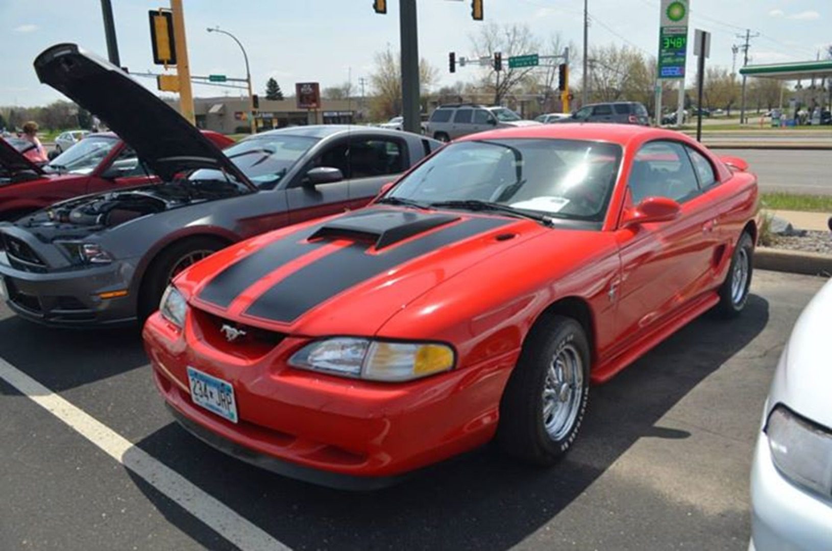 Classic red sports car with stripes