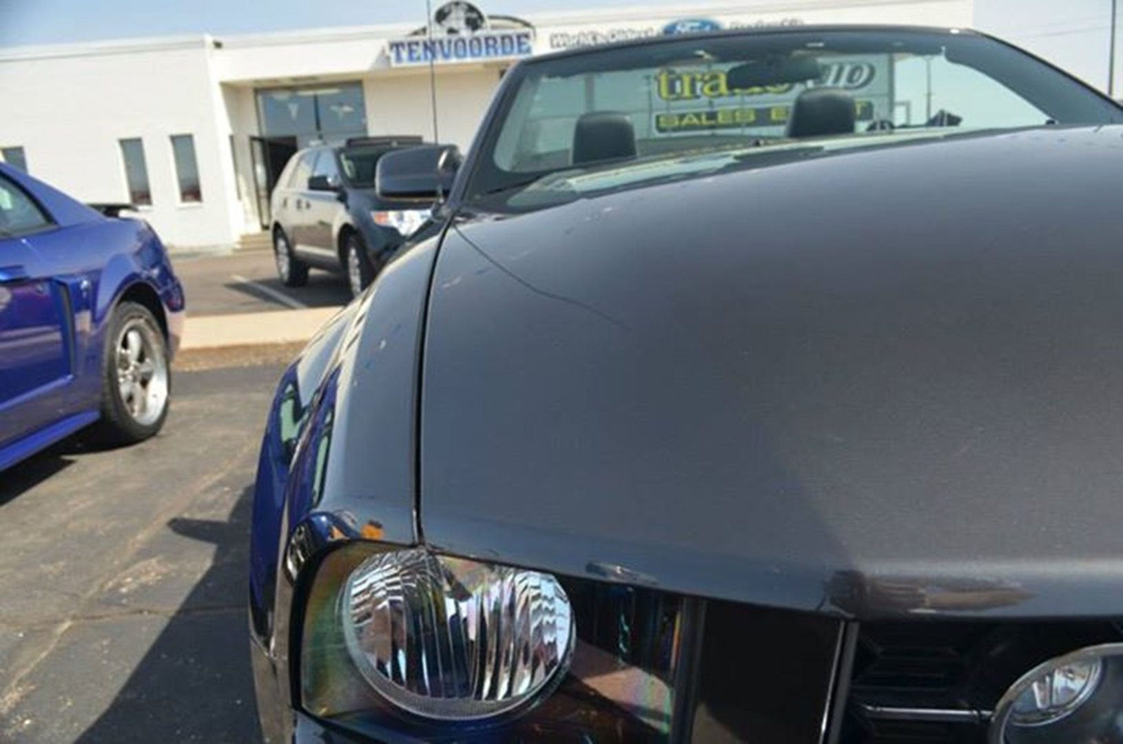 Shiny car exterior in sunny lot