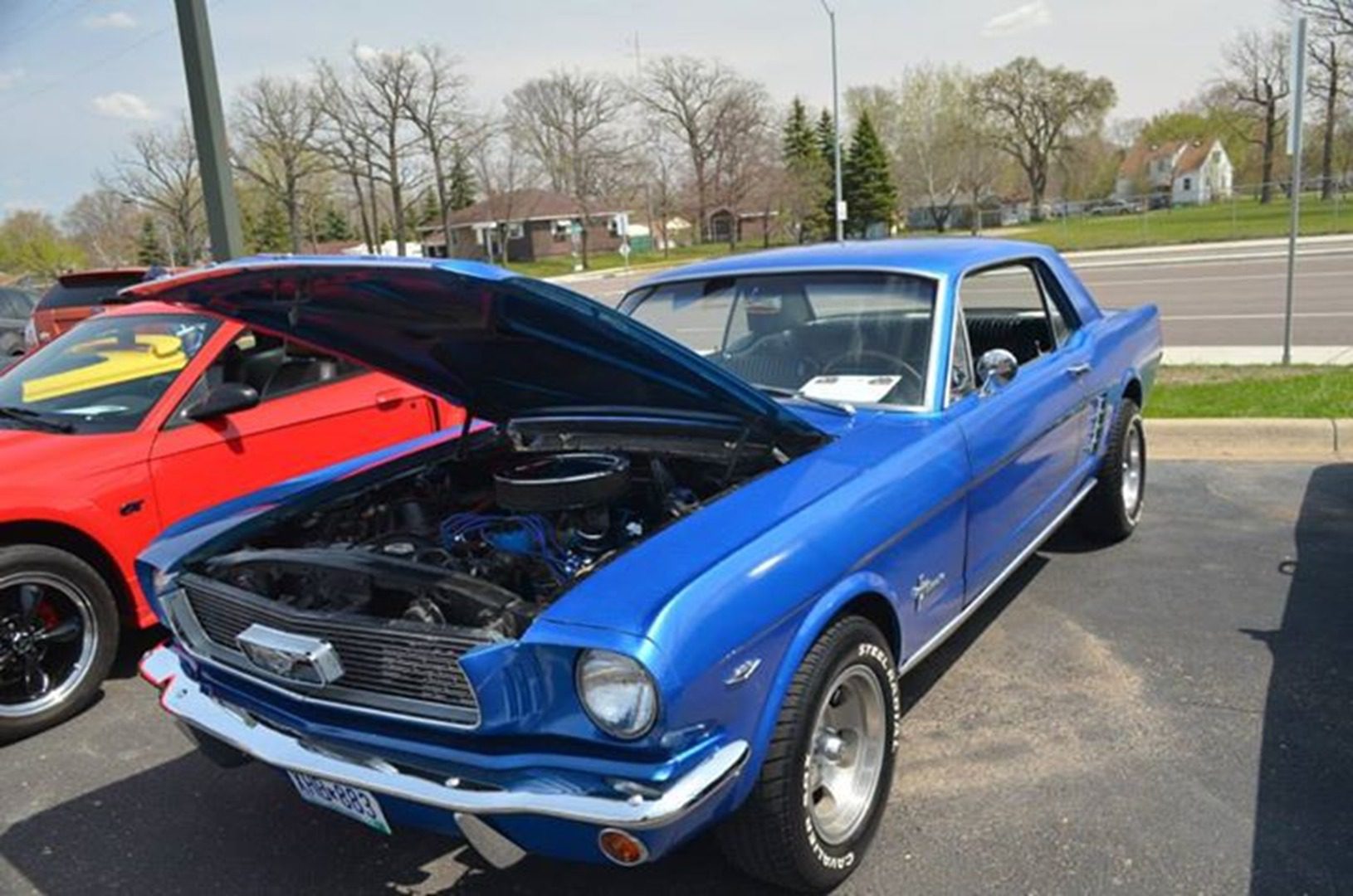 Blue classic car with open hood