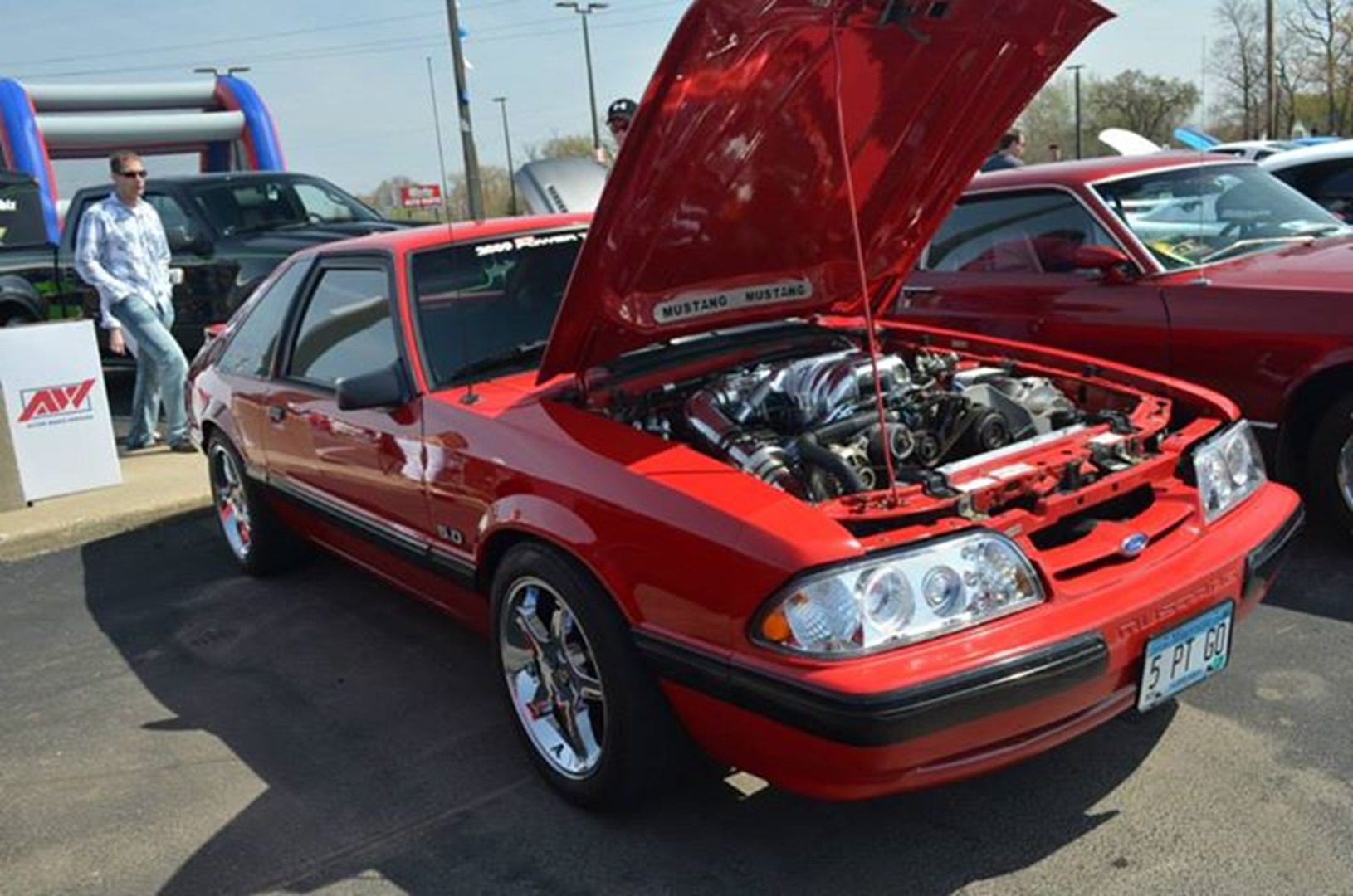 Classic car show with red Mustang