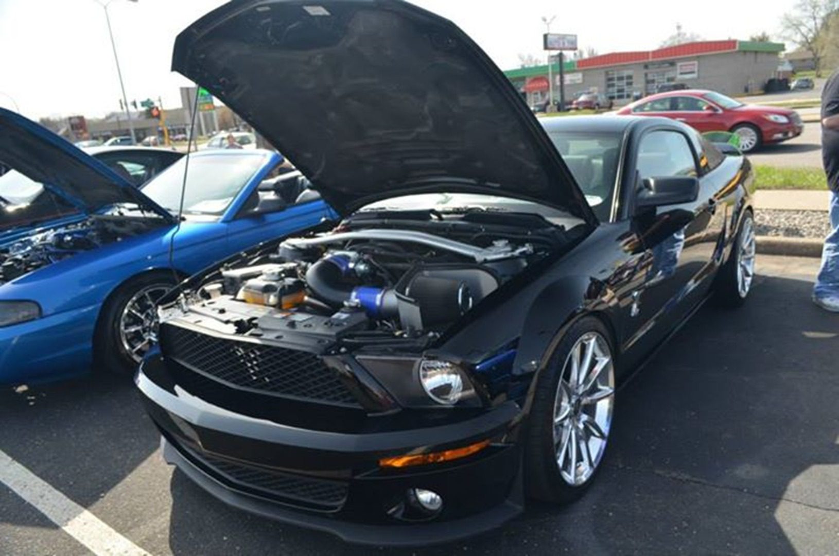 Black sports car with open hood
