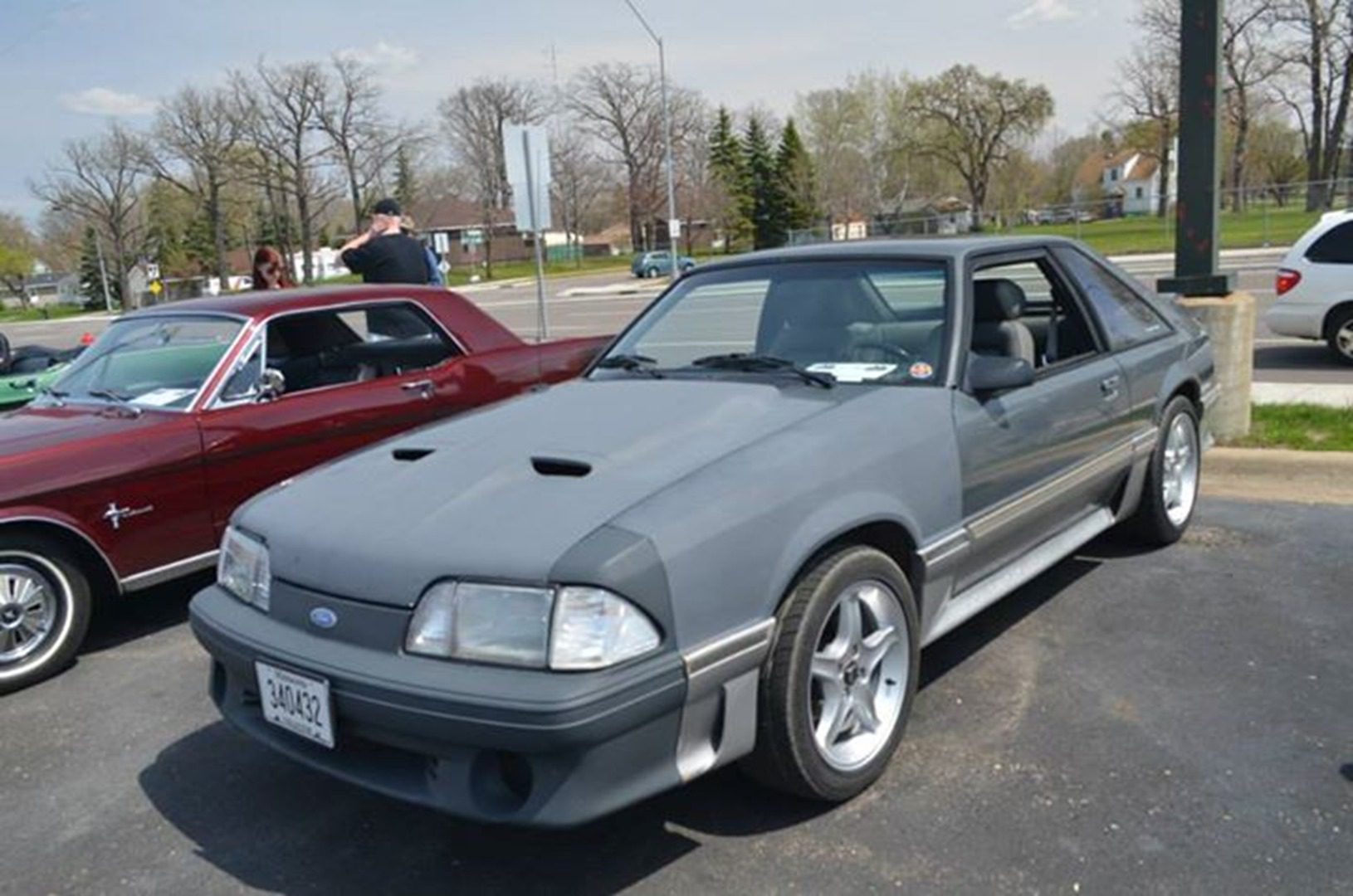 Gray sports car in parking lot
