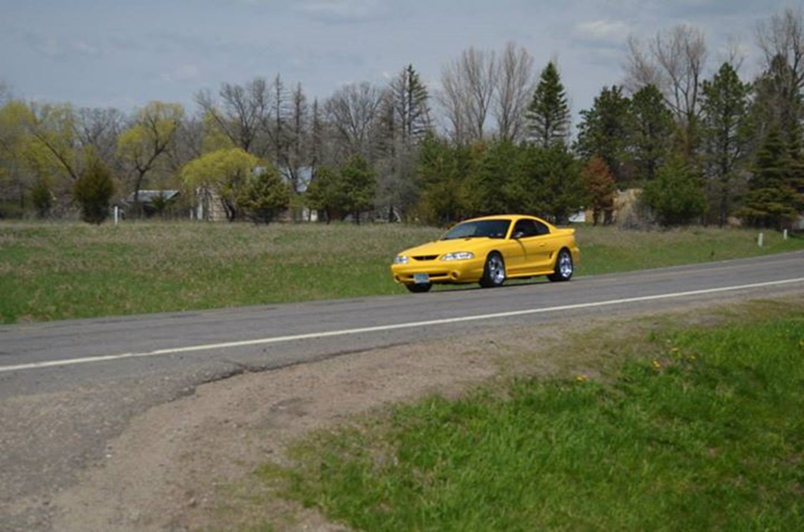 Sports car cruising through countryside