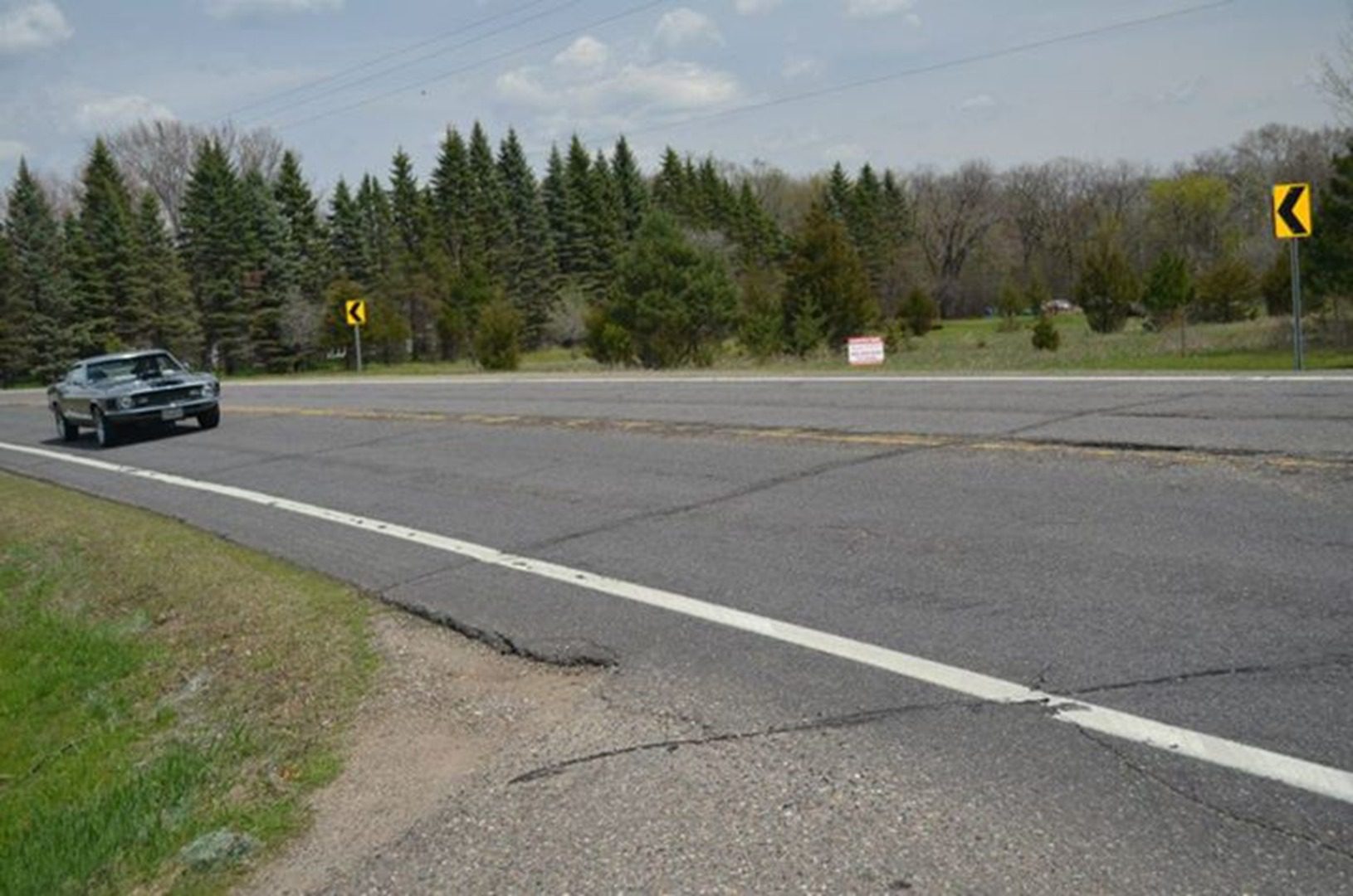 Vehicle approaching curve on country road