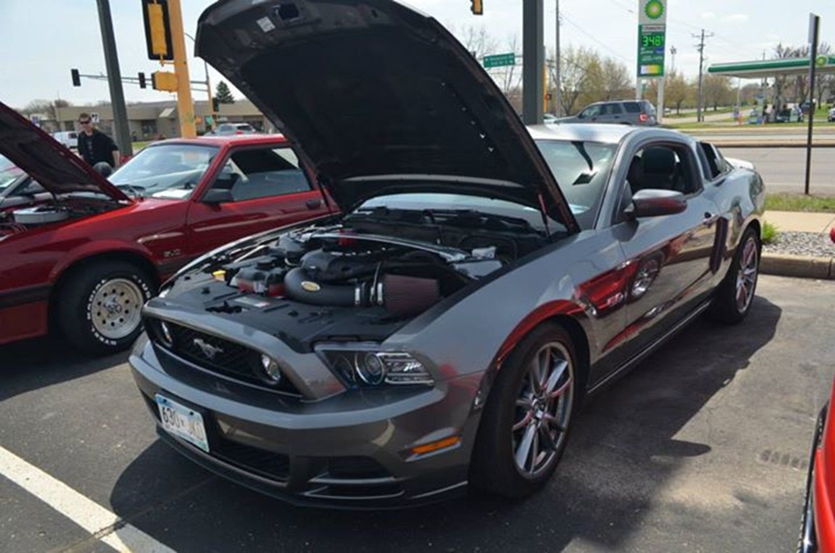 Performance car engine visible at event