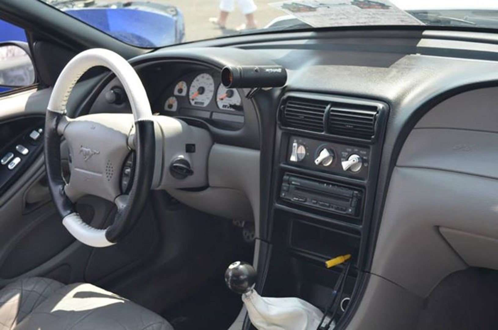 Classic car interior with white steering wheel