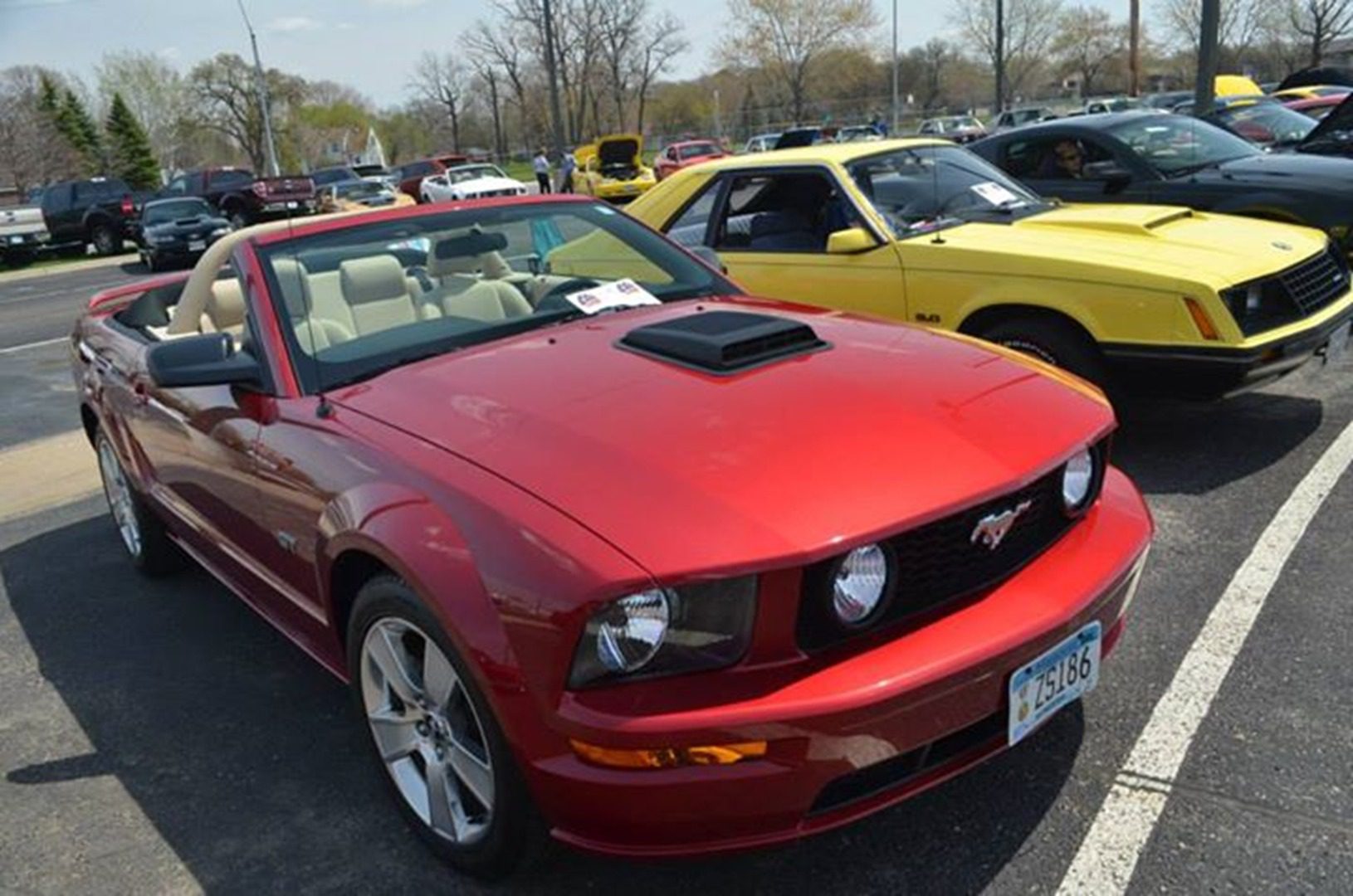 Shiny red Mustang with beige interior